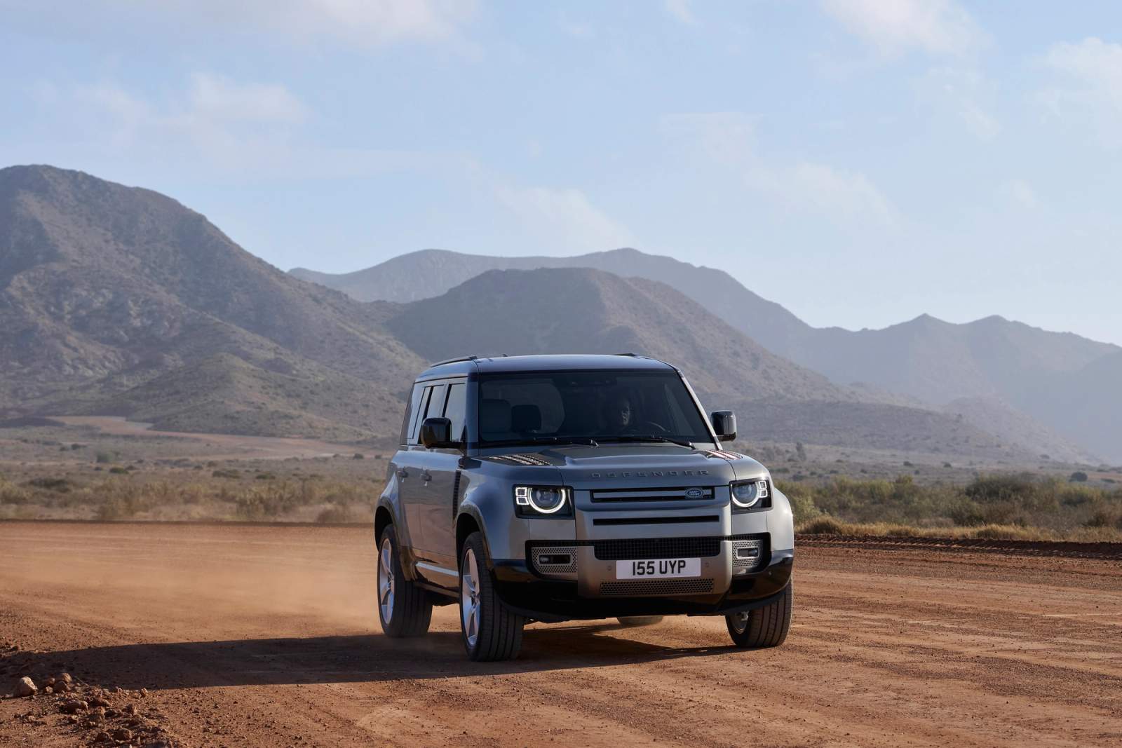 Grey Land Rover Defender driving