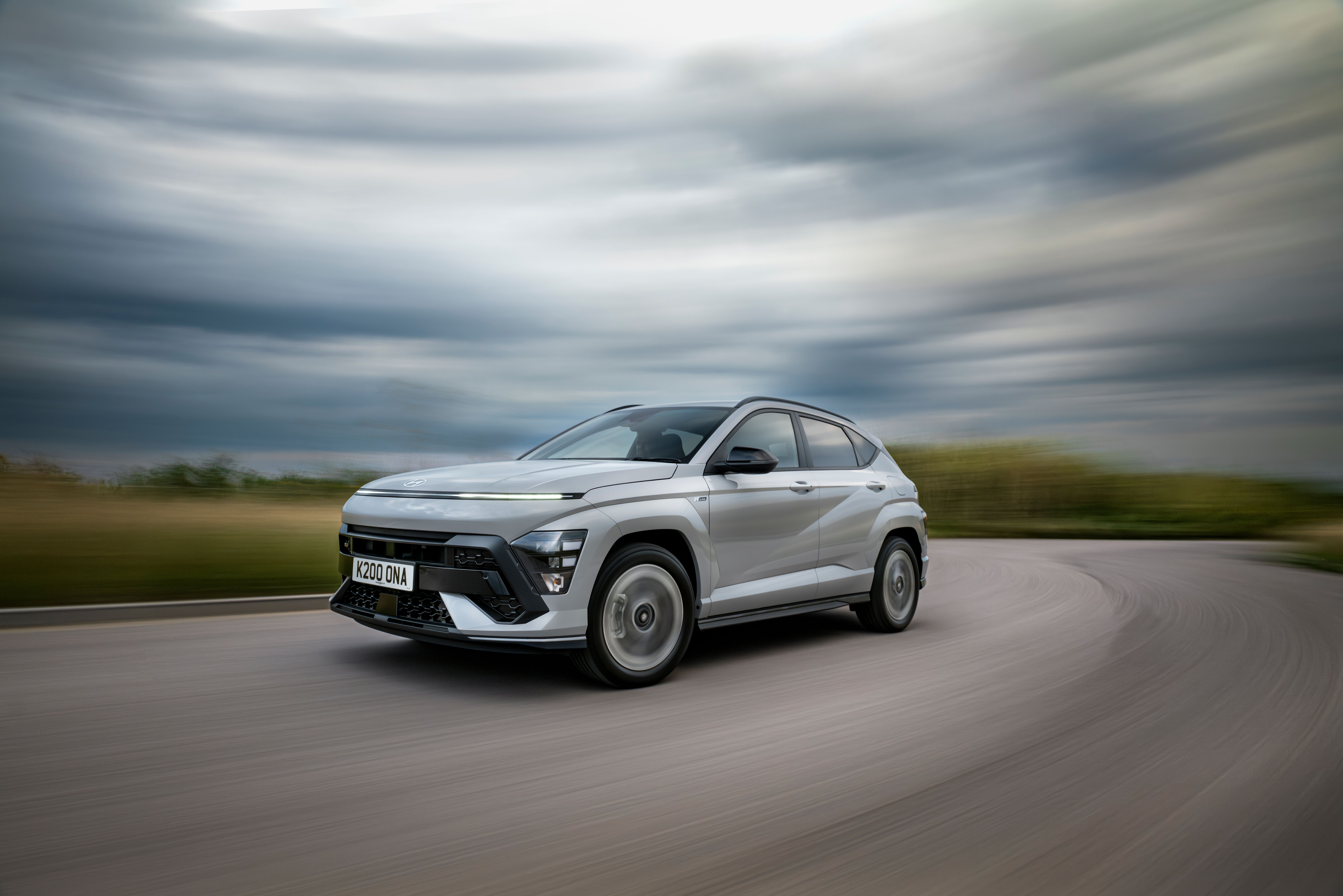 Silver Hyundai Kona driving