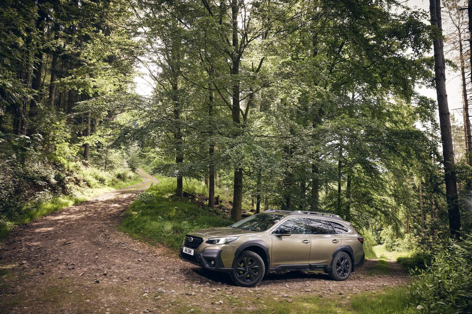 Beige Subaru Outback off-roading