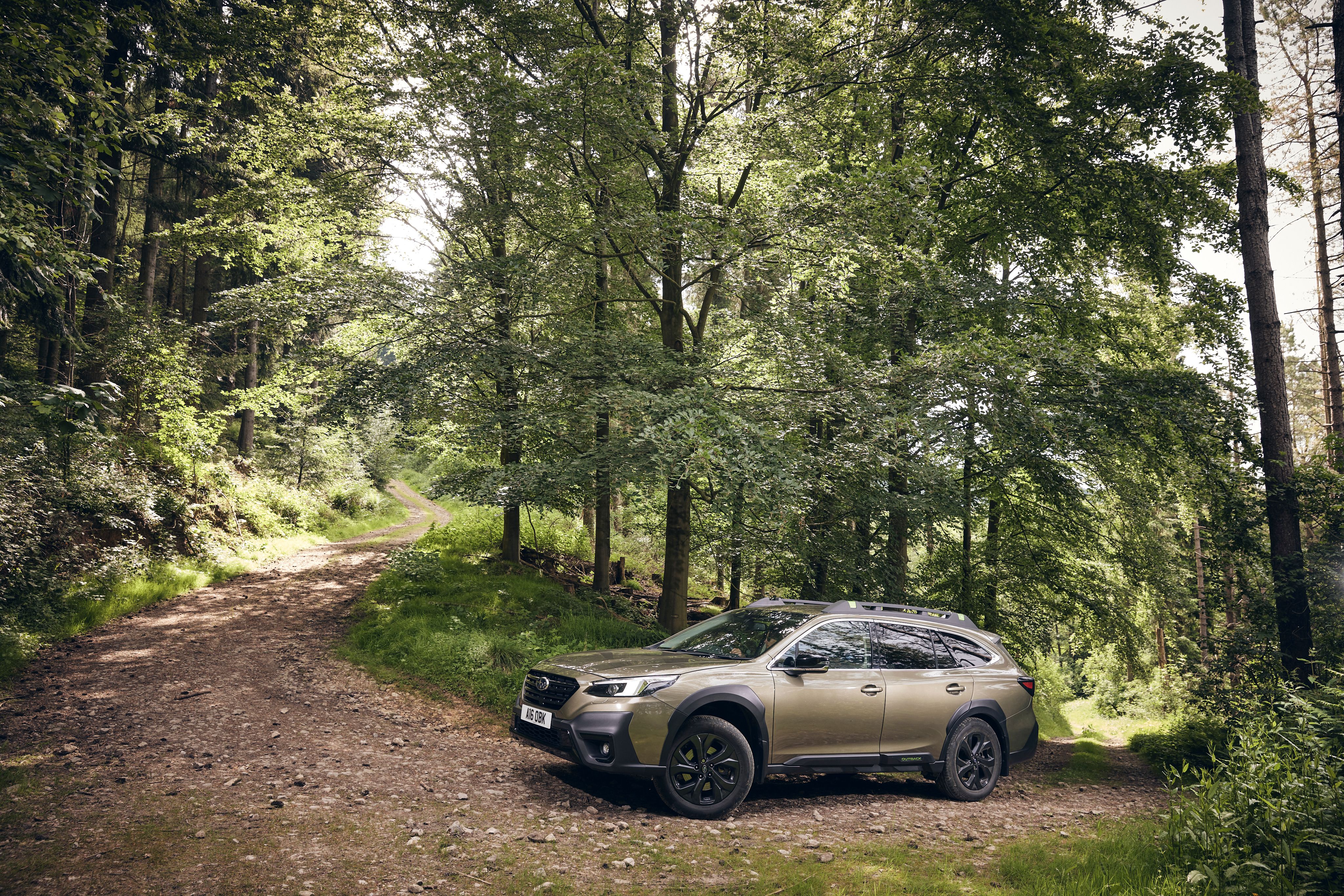 Beige Subaru Outback off-roading