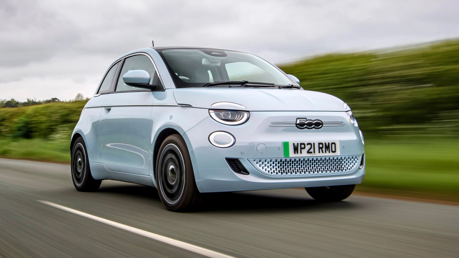 Blue Fiat 500e front driving