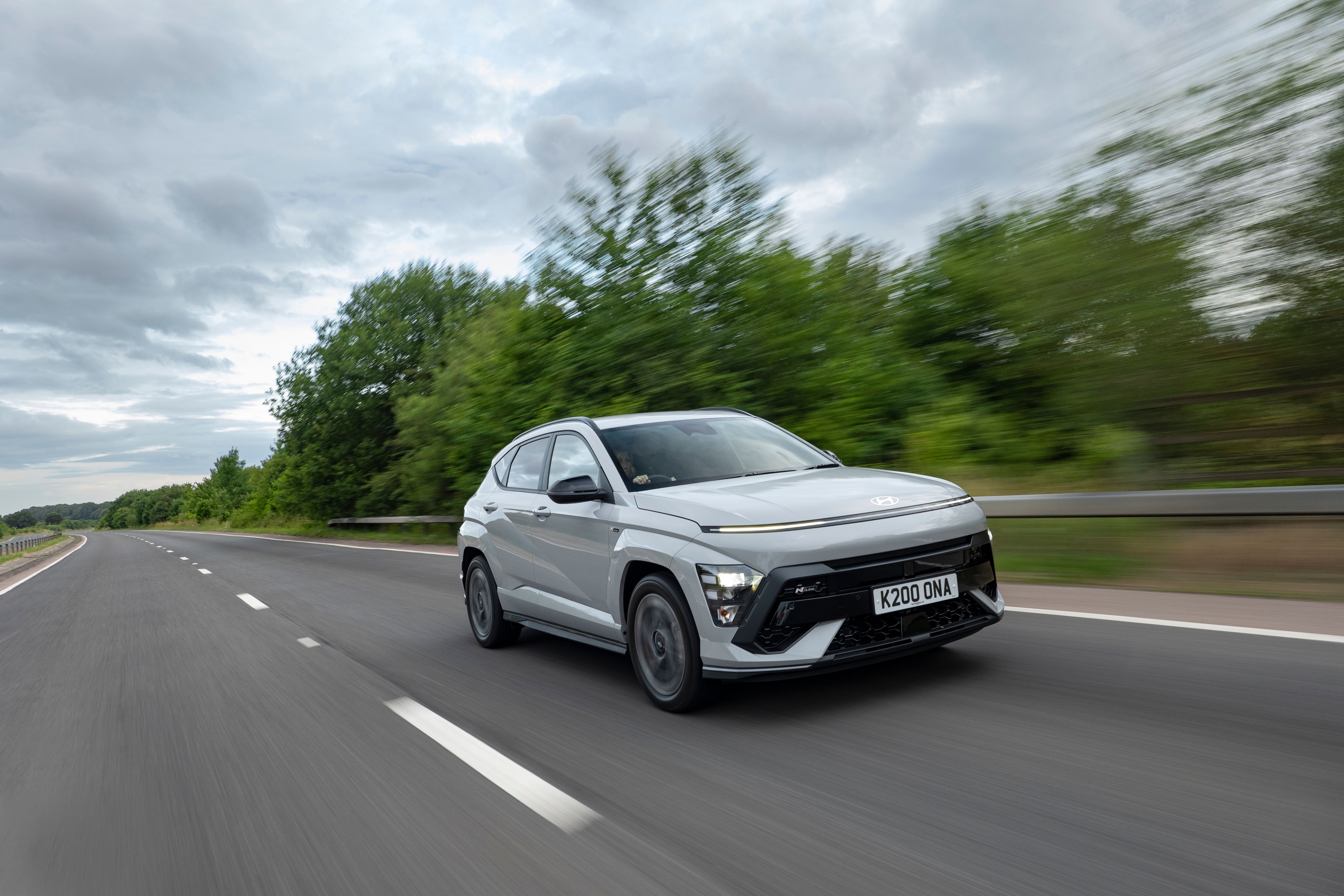 Silver Hyundai Kona driving
