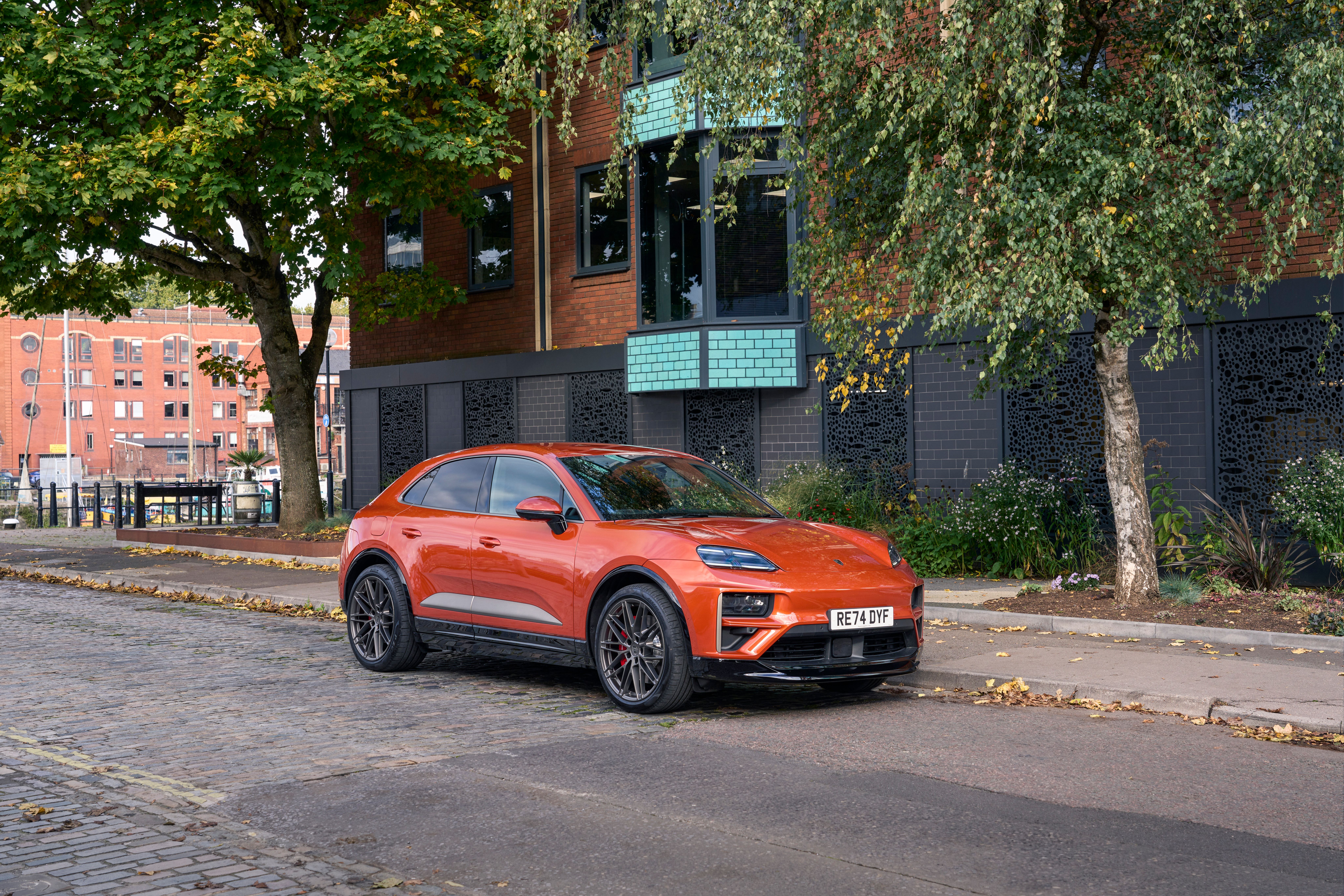 orange macan on road