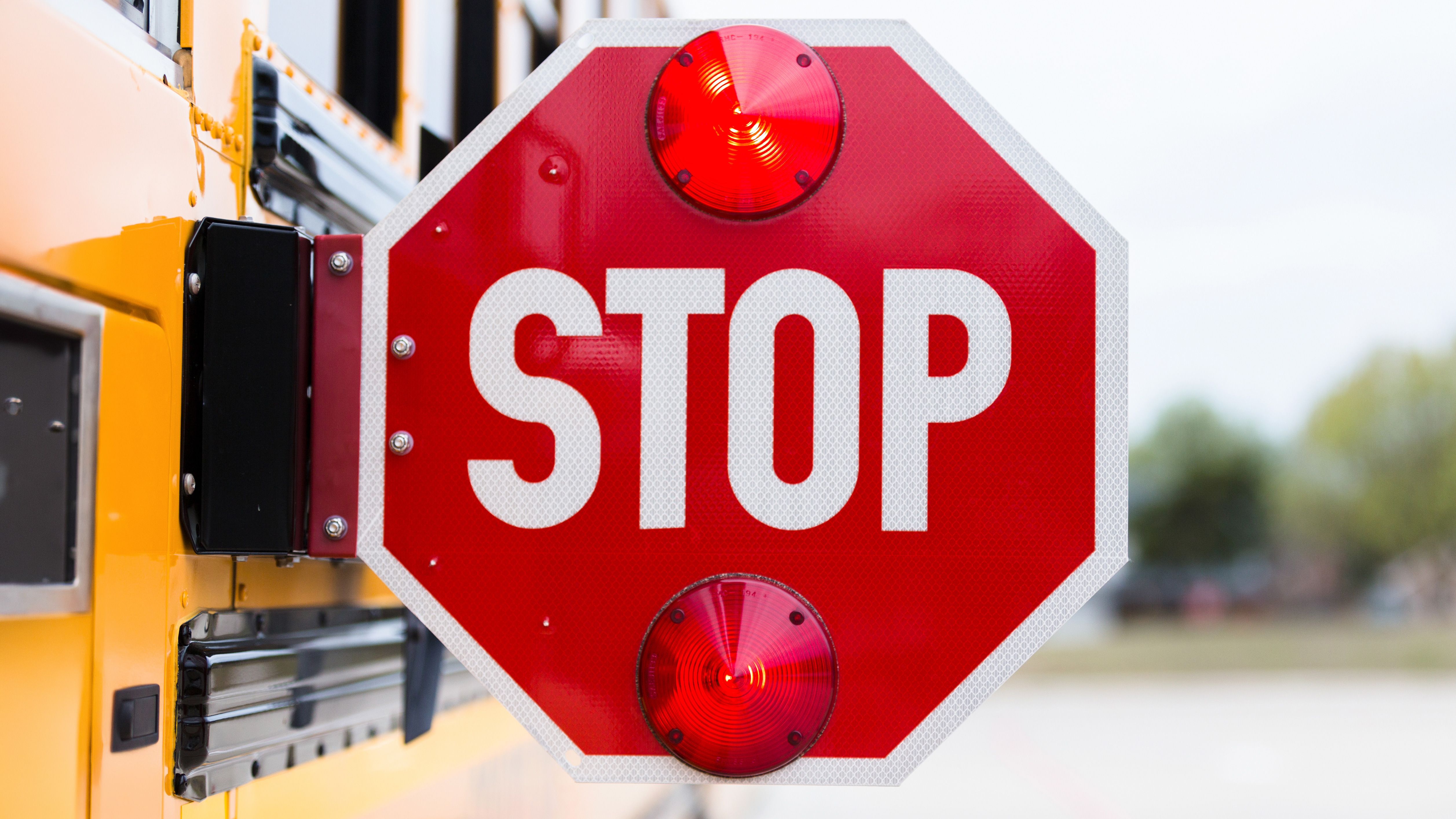 American school bus with Stop sign extended