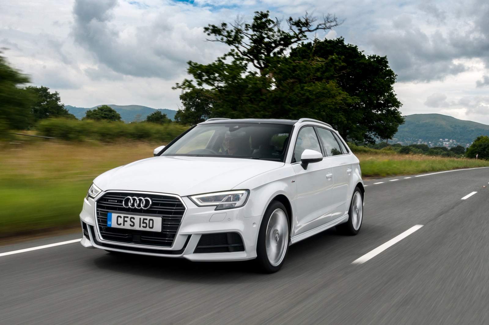 white car on road