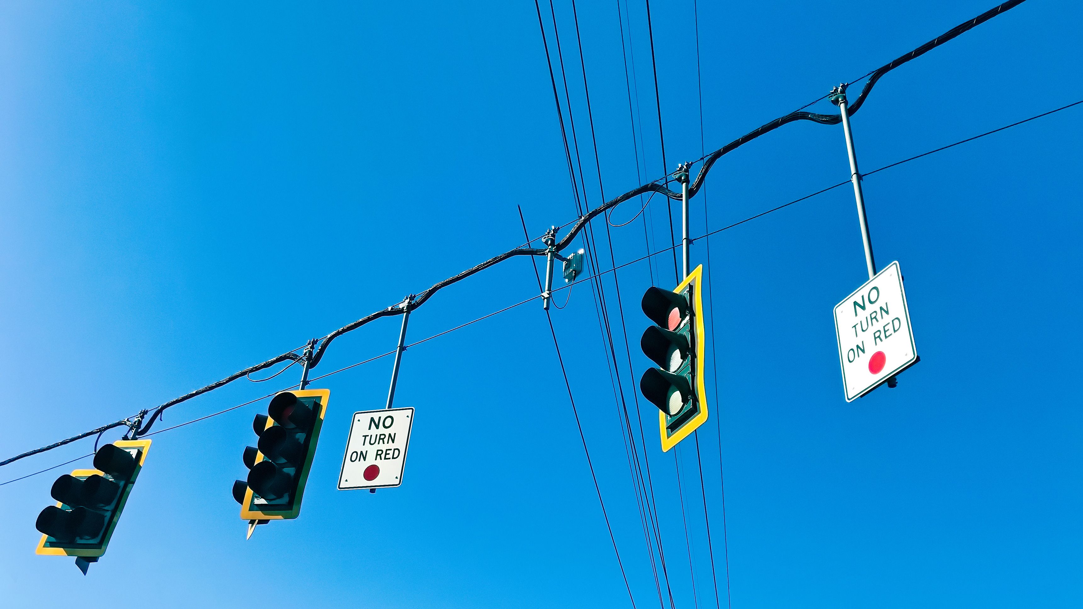 American traffic lights with 'no turn on red' signs