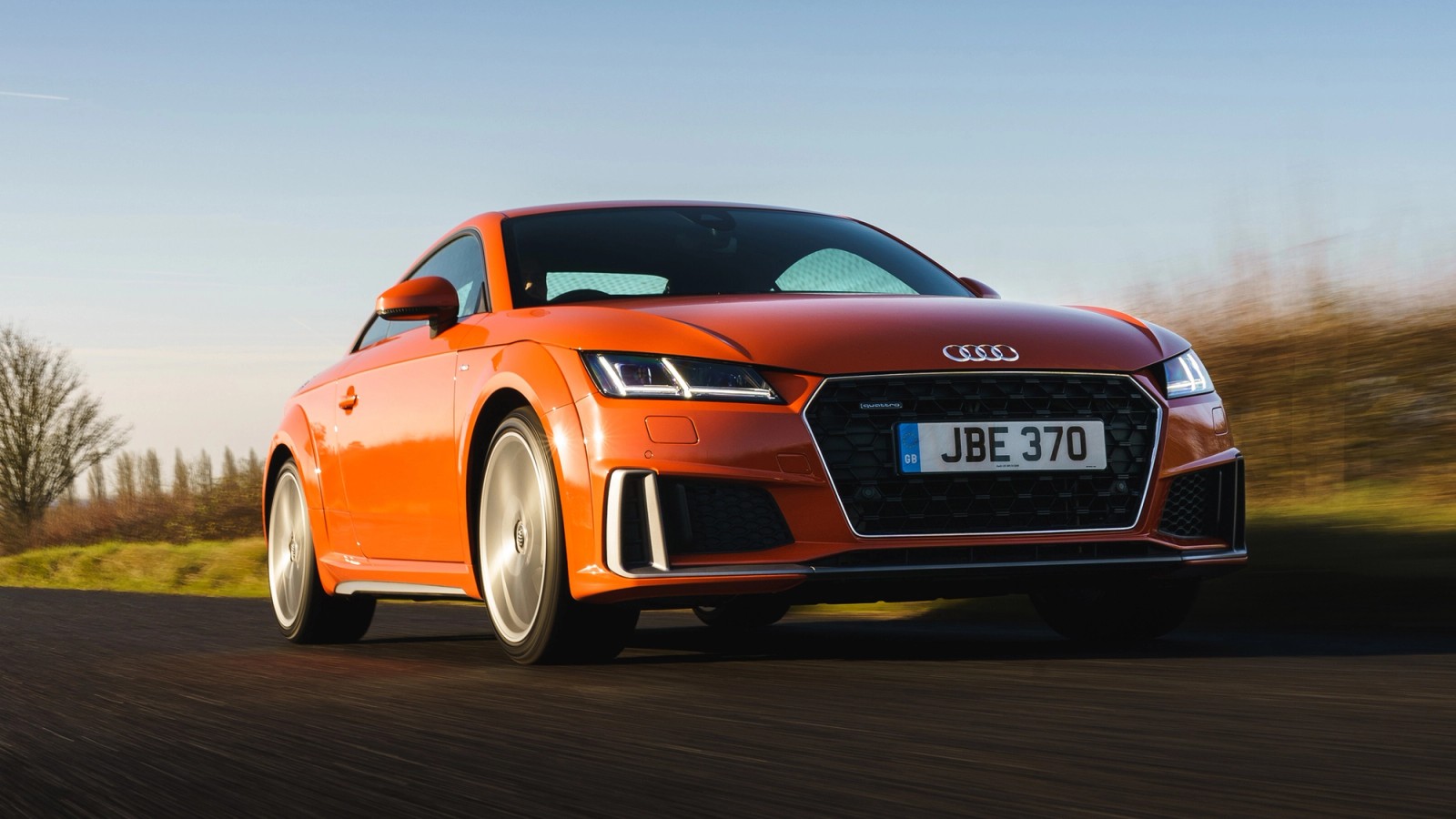 Orange Audi TT front driving