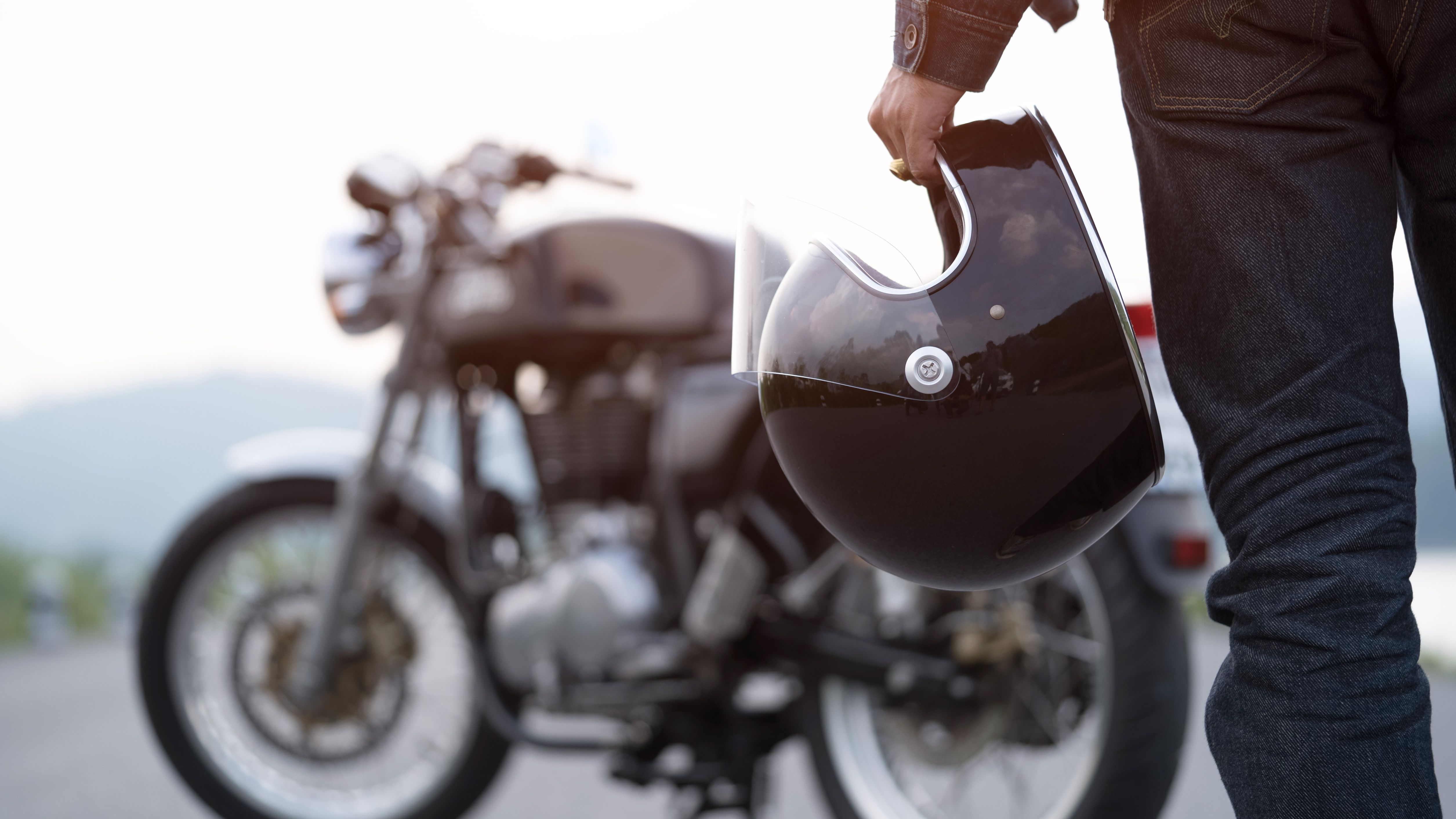 Motorbike helmet in hand