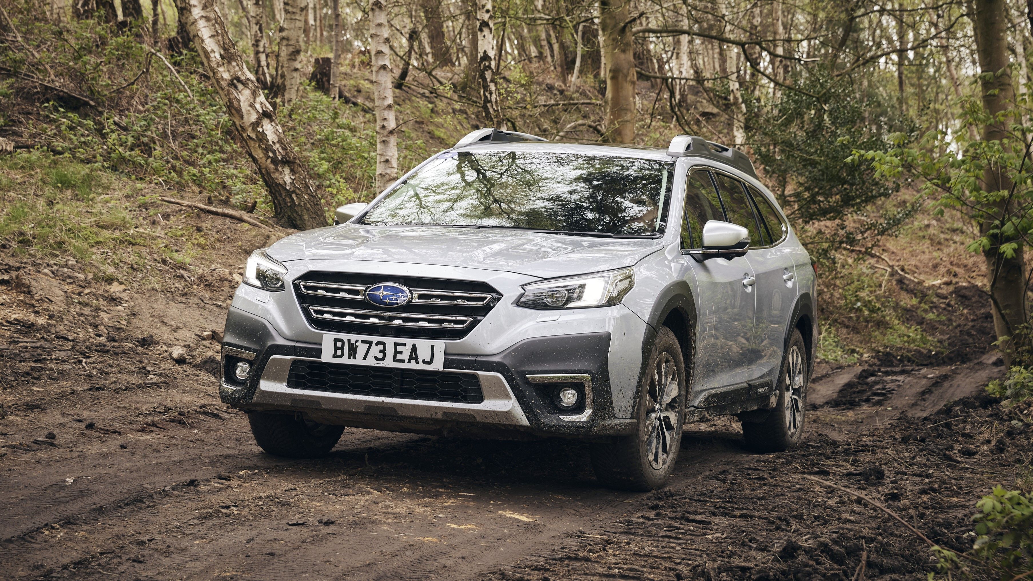 Silver Subaru Outback off-roading