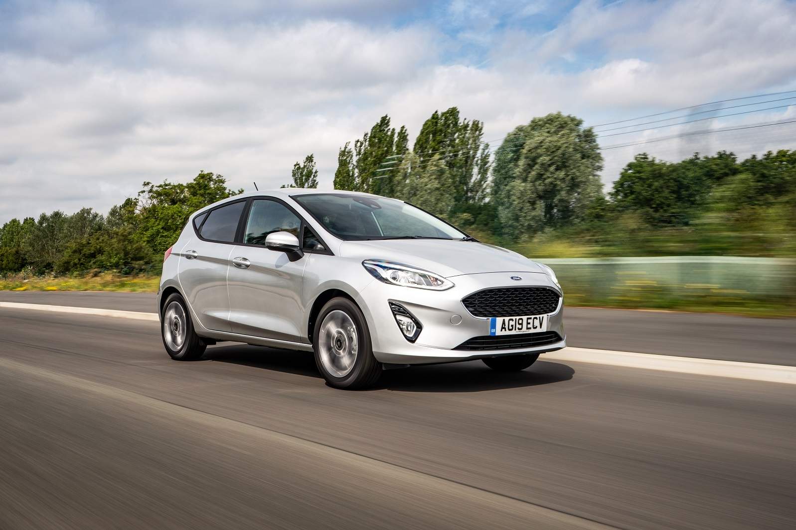 Silver Ford Fiesta driving