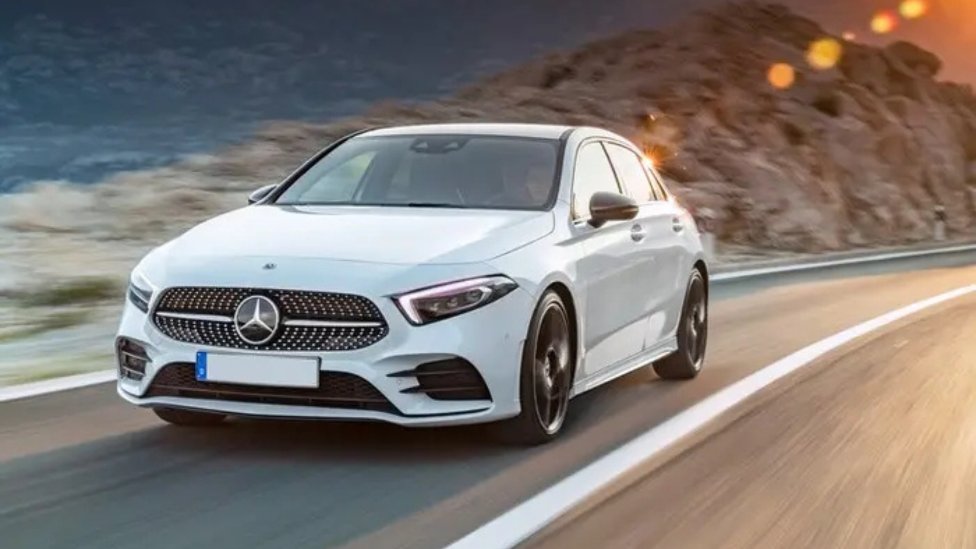 white mercedes on the road