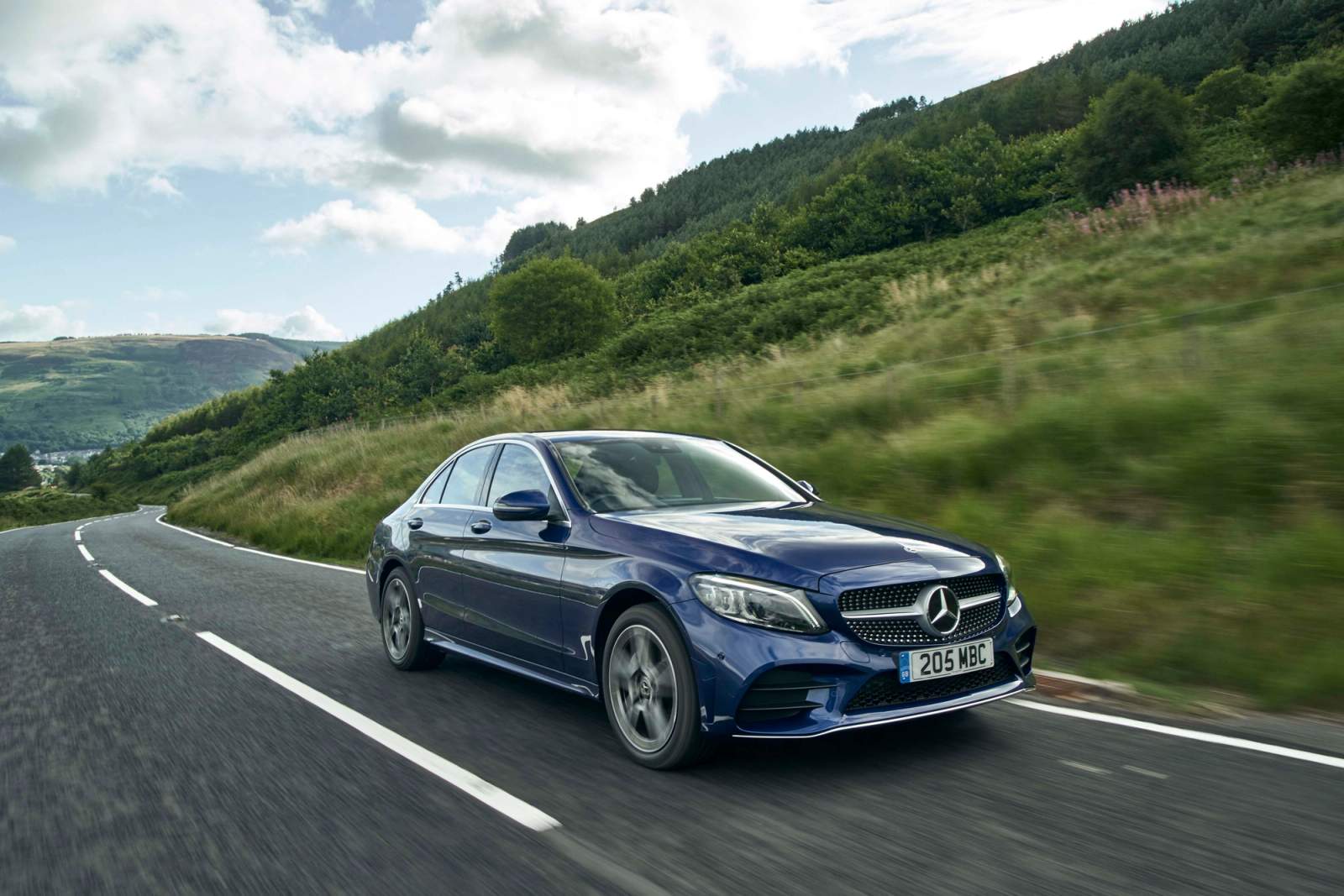blue car driving 