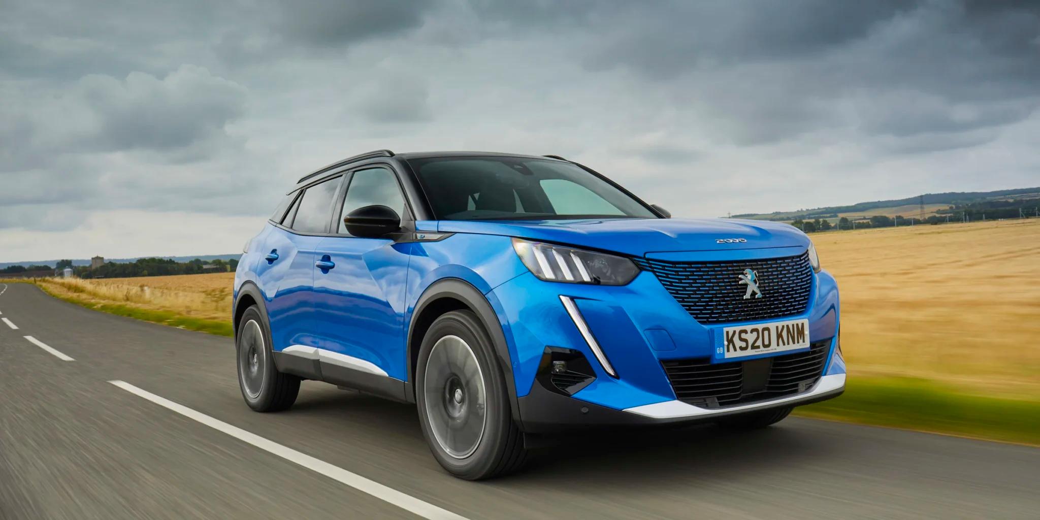 blue peugeot on the road