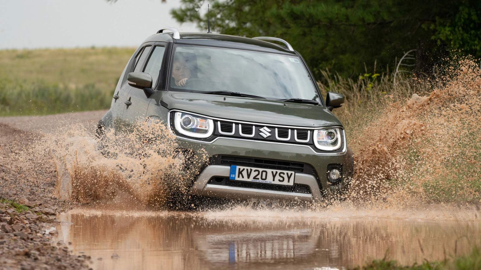 Dark green Suzuki Ignis fording water