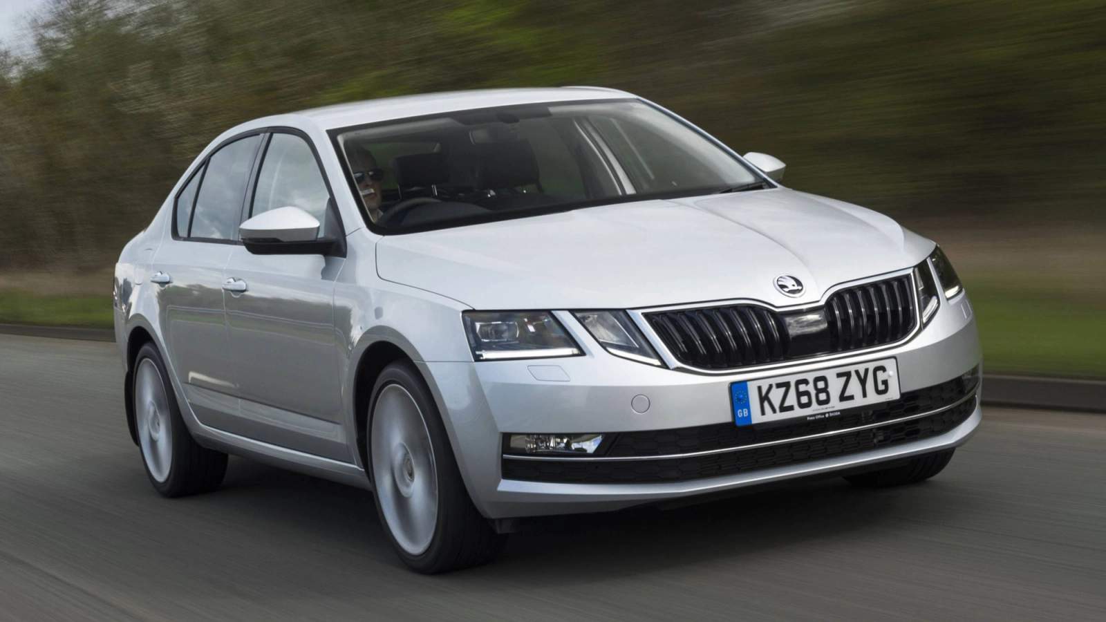 Silver Skoda Octavia hatchback driving