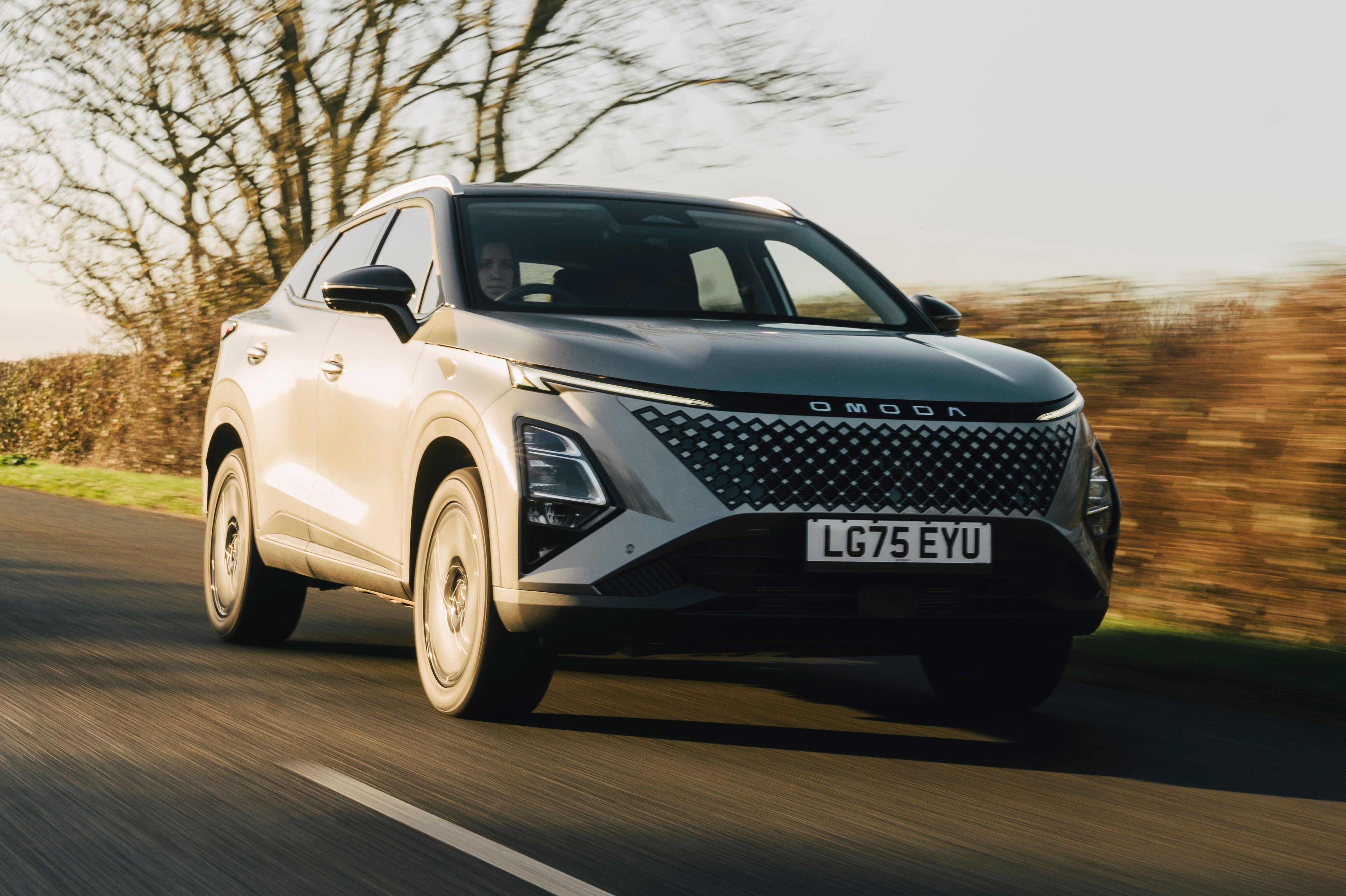 Grey Omoda 5 driving