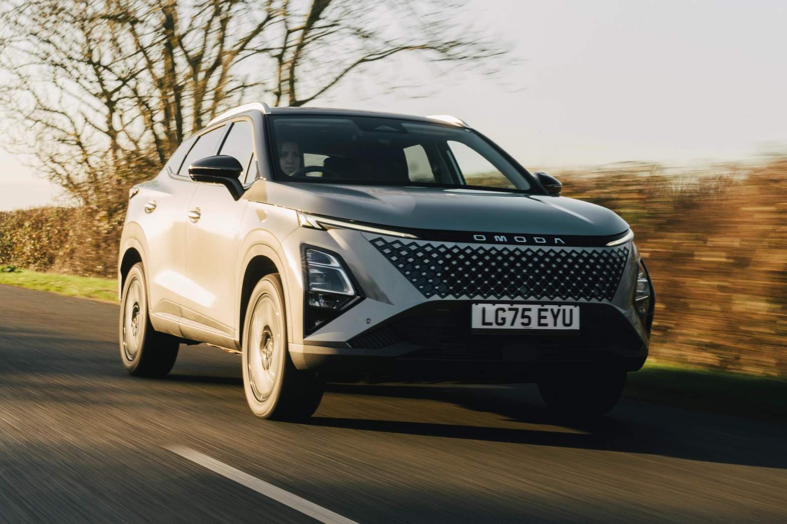Grey Omoda 5 driving