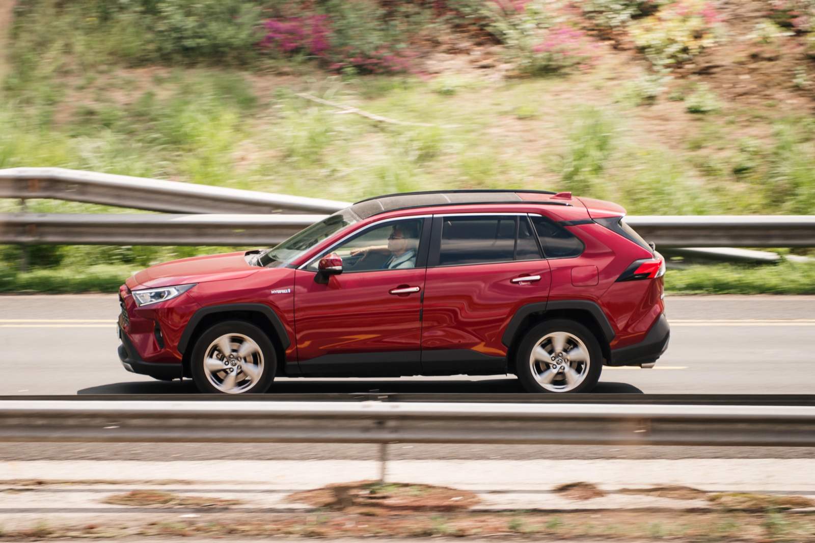 red suv on the road