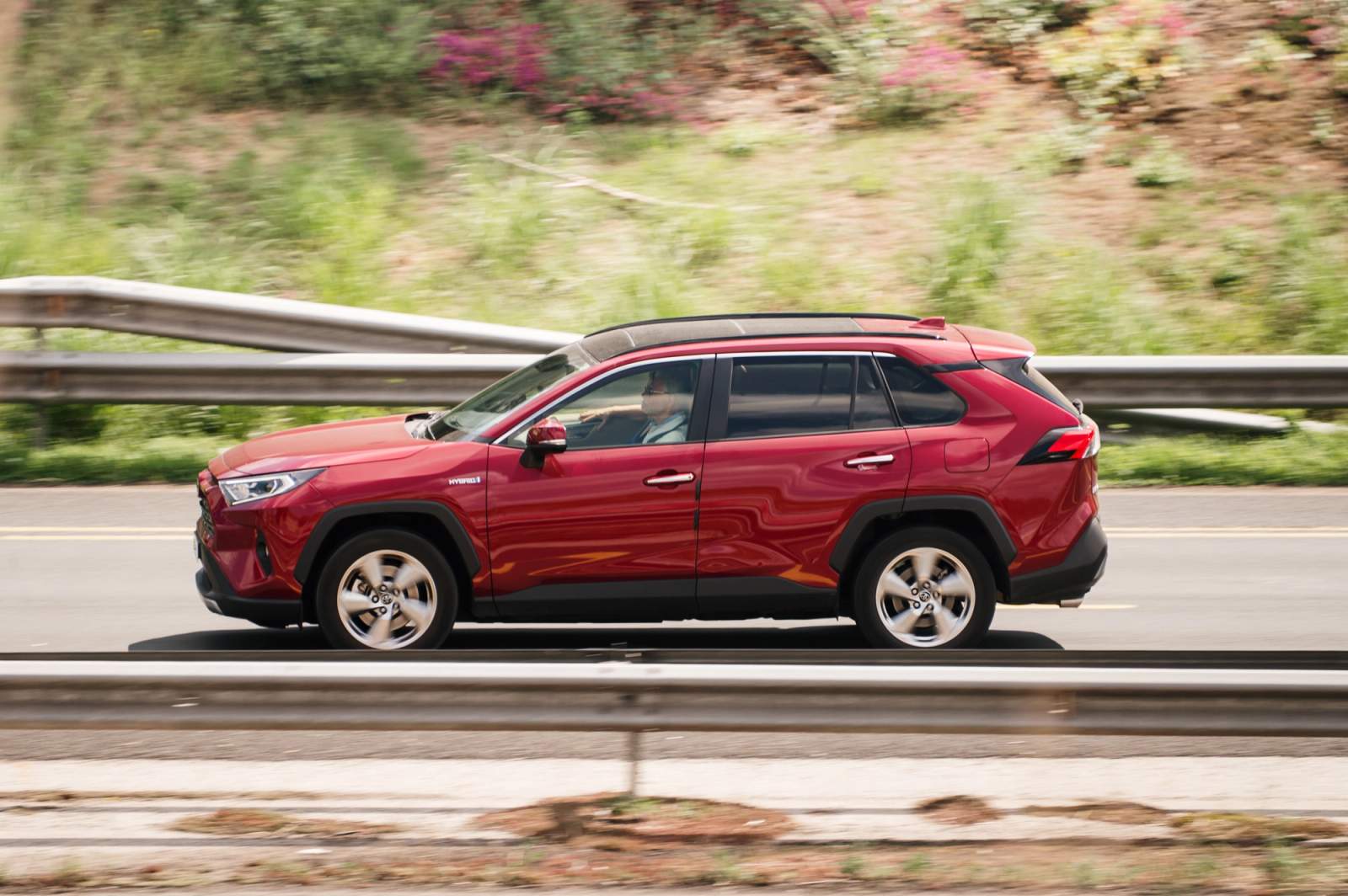 red suv on the road
