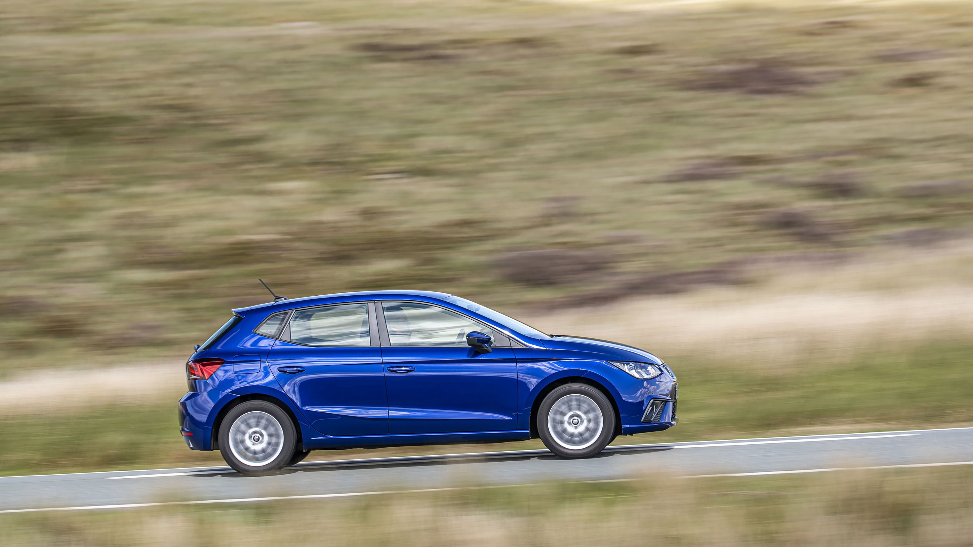 Blue Seat Ibiza side driving