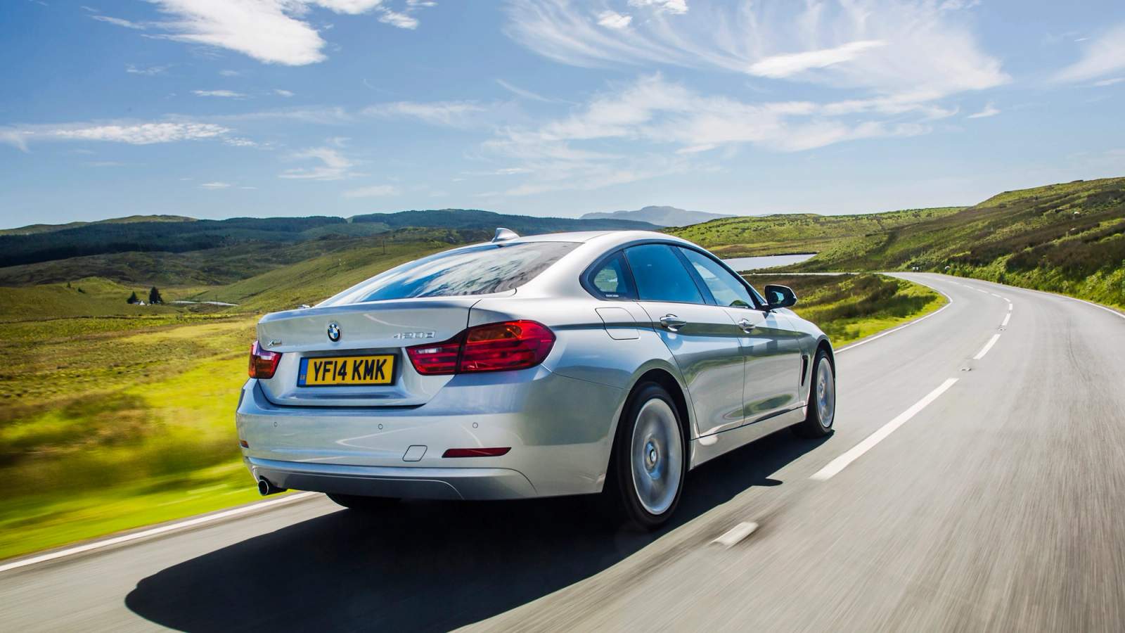 Silver BMW 4 Series Gran Coupe rear driving