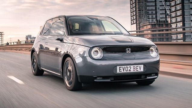 Honda e front quarter driving around Croydon