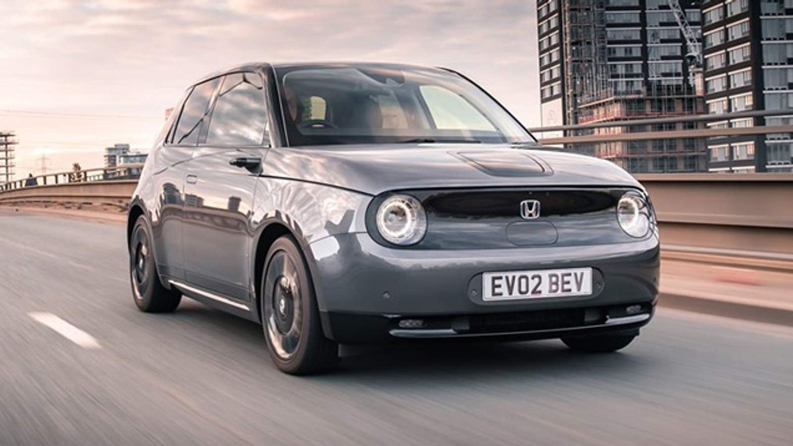 Honda e front quarter driving around Croydon