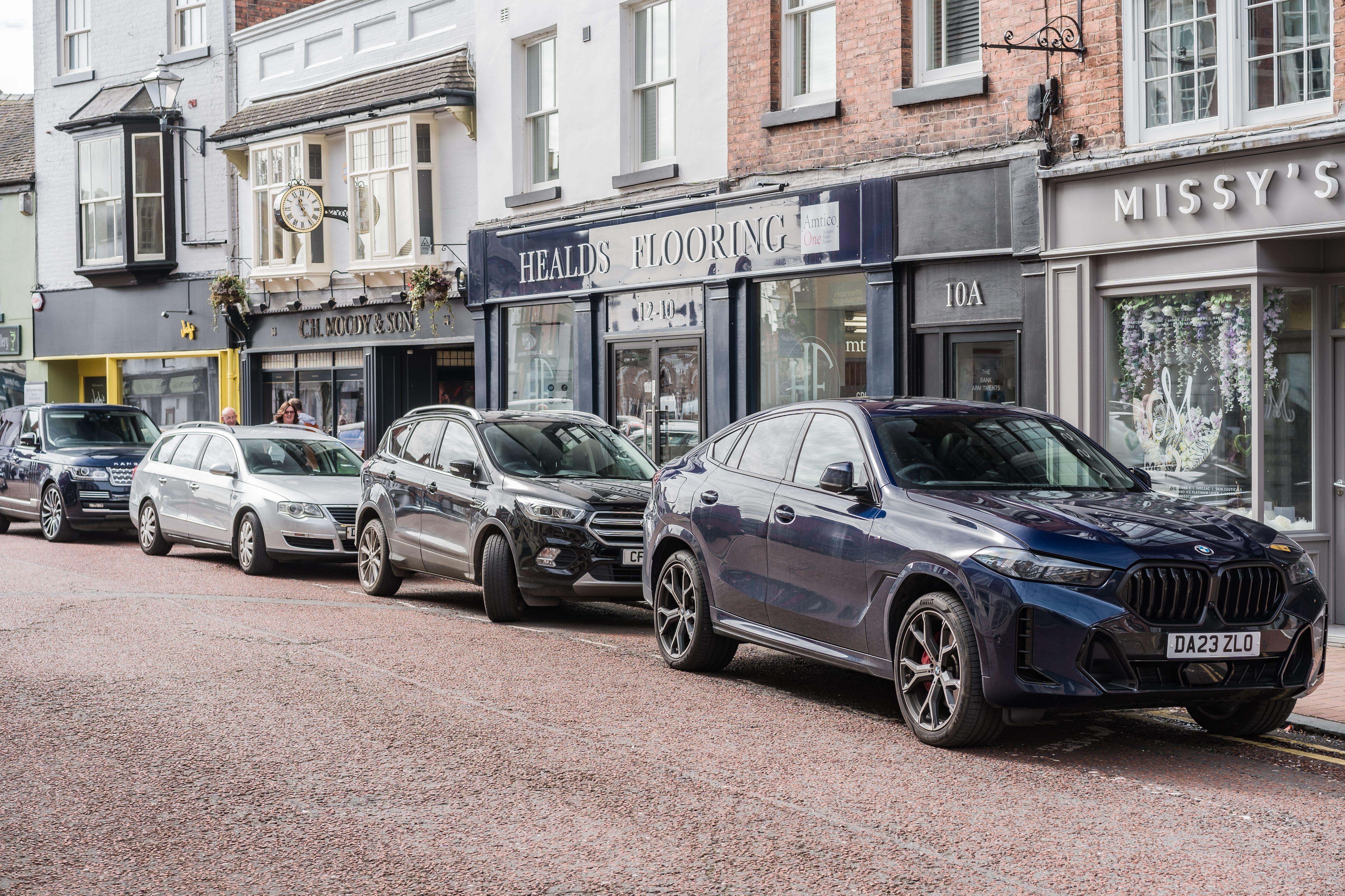 Car parked in front of shops