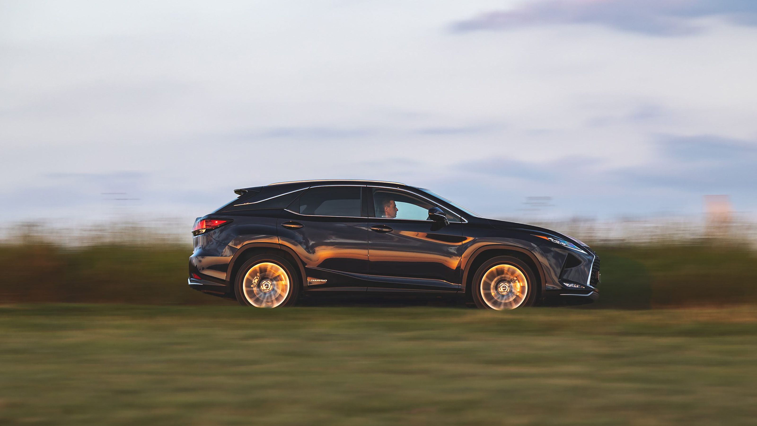 Blue Lexus RX side driving