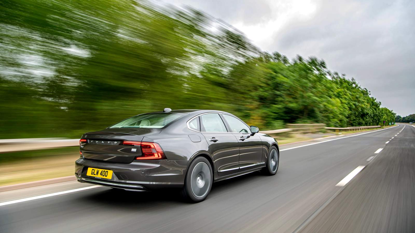 Brown Volvo S90 rear driving