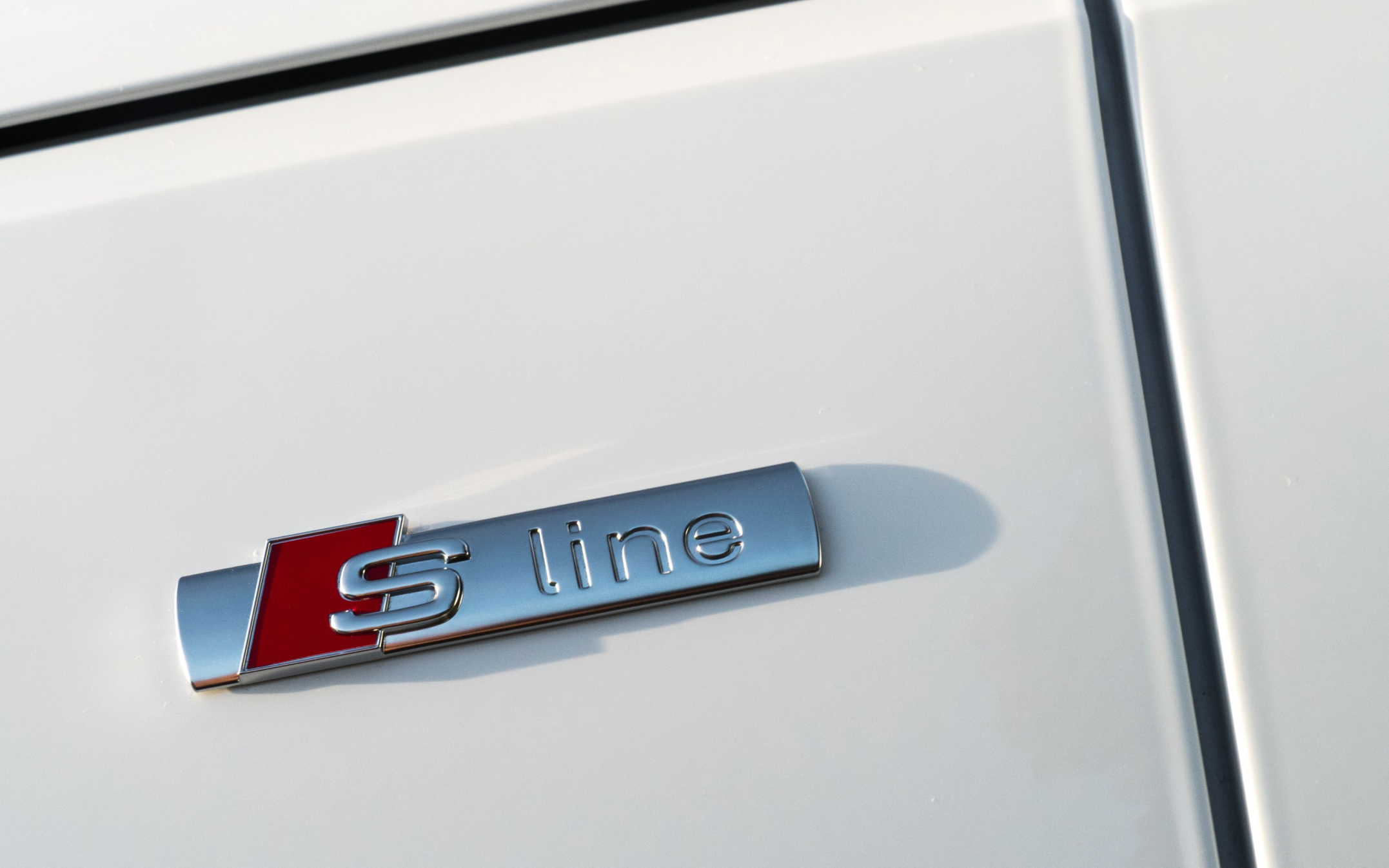 s-line badge