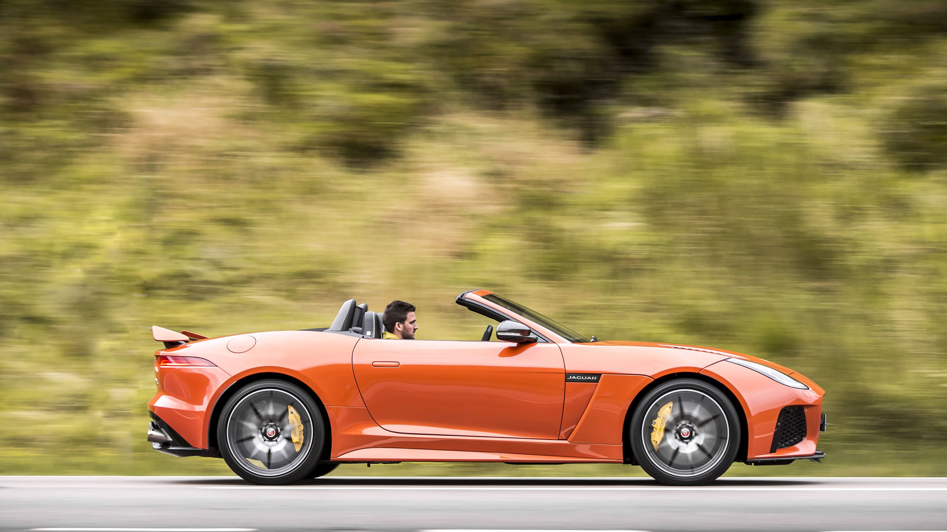 Orange Jaguar F-Type SVR side driving