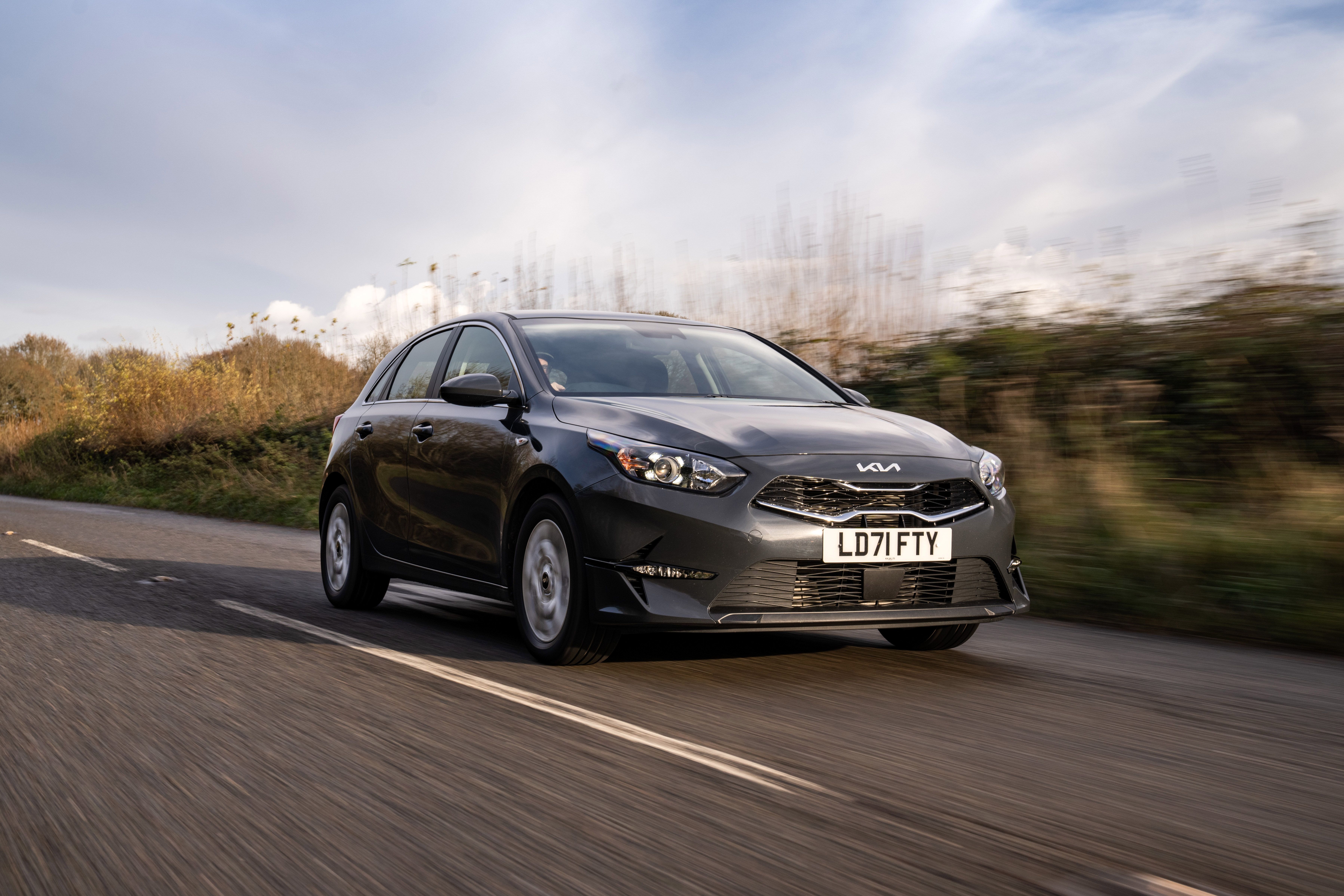 Grey Kia Cee'd driving