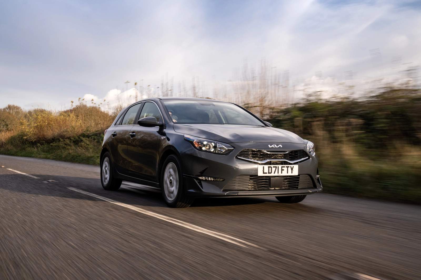 Grey Kia Cee'd driving