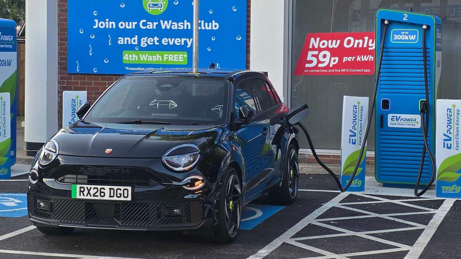 Abarth 600e charging at a public charge point