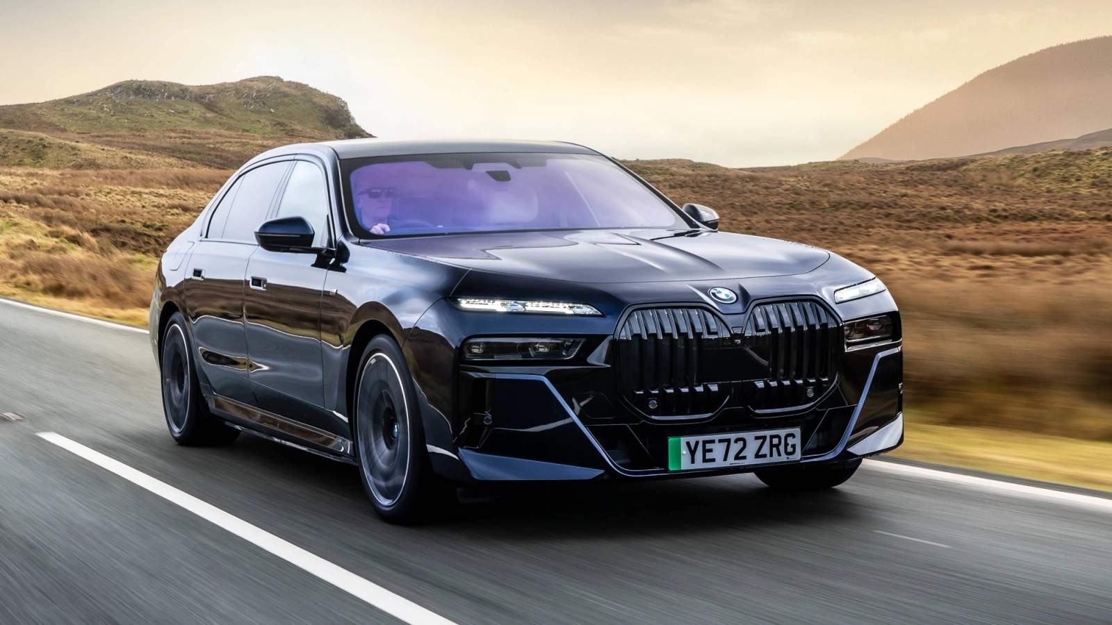 Black BMW i7 driving