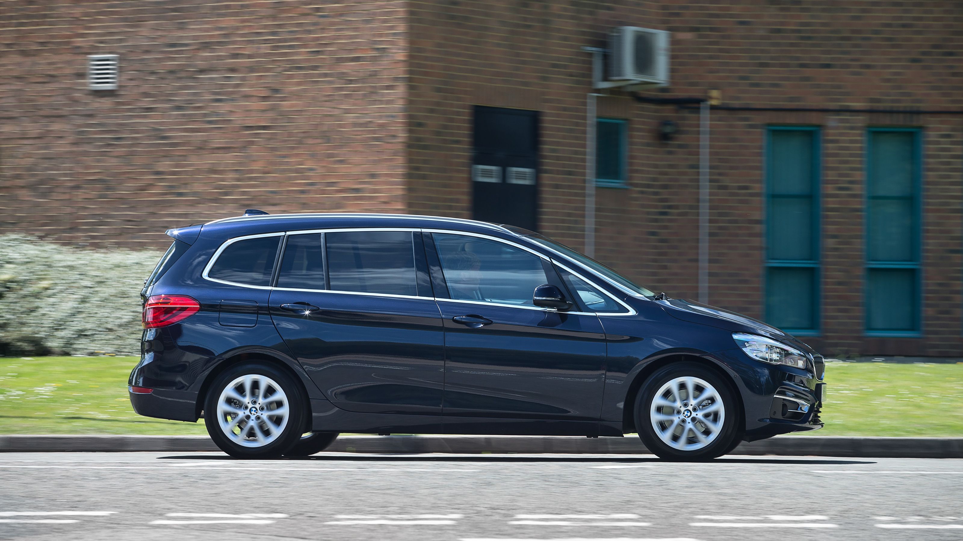 Blue BMW 2 Series Gran Tourer side driving