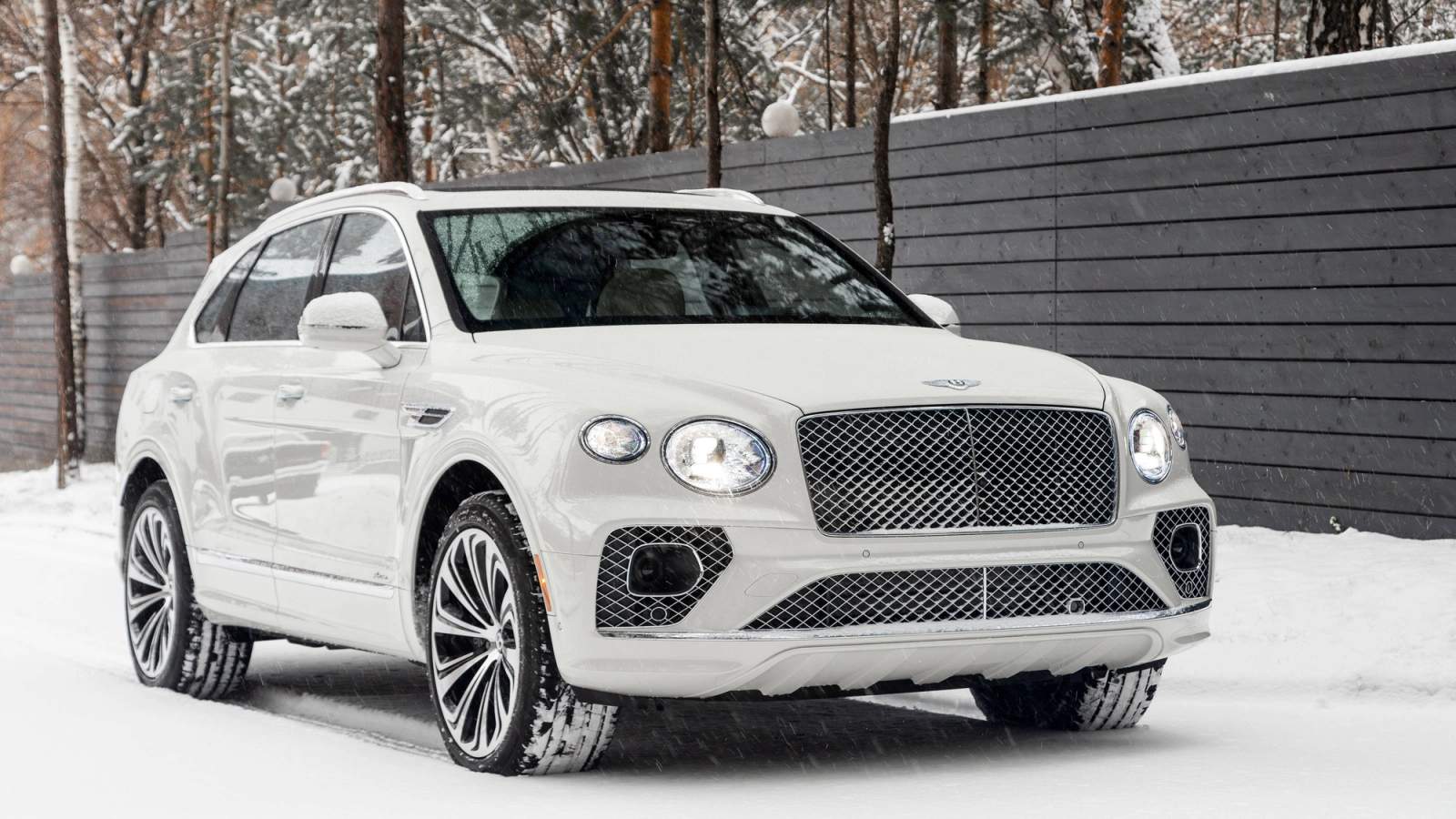 White Bentley Bentayga parked in the snow