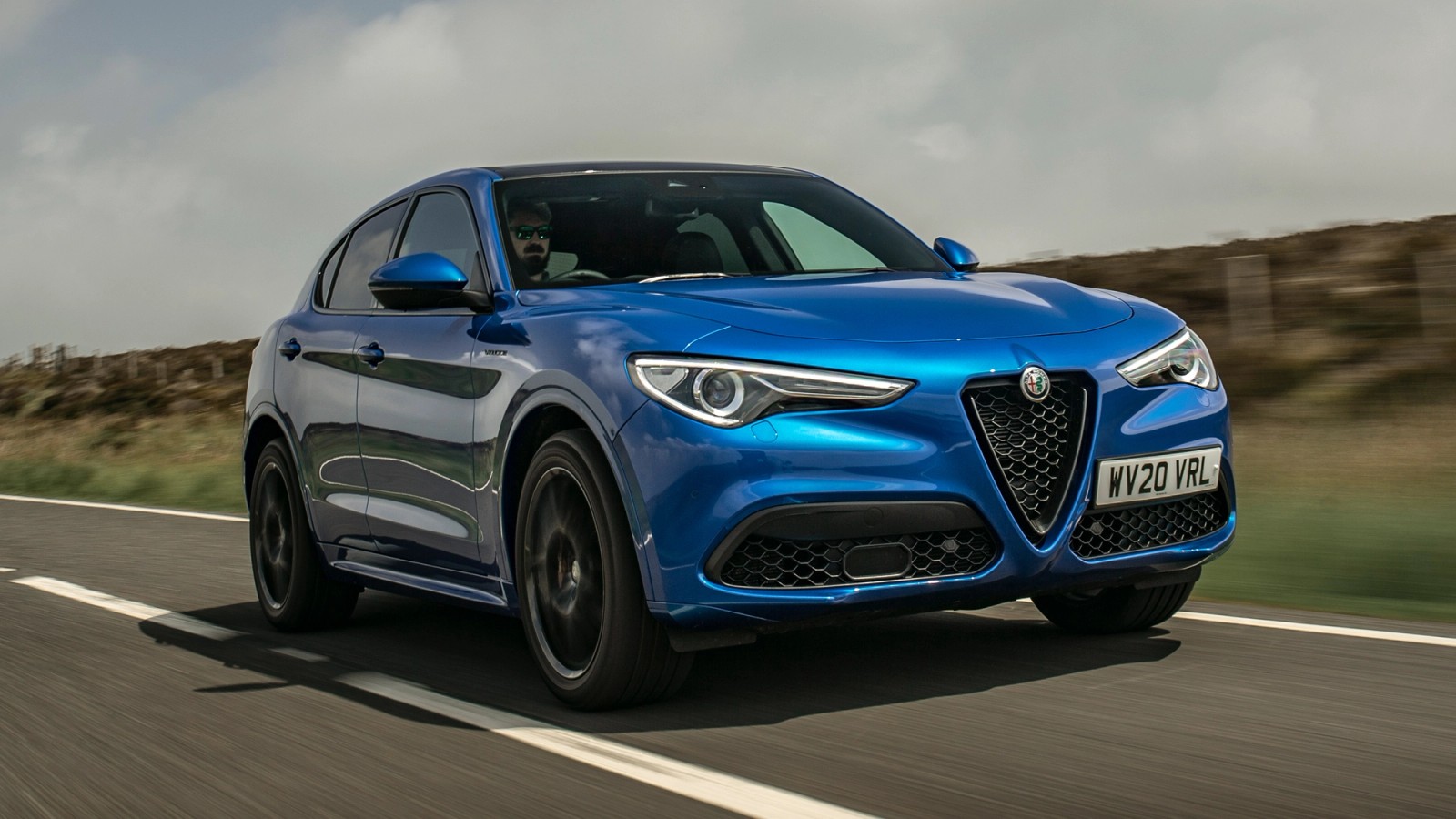 Blue Alfa Romeo Stelvio front driving