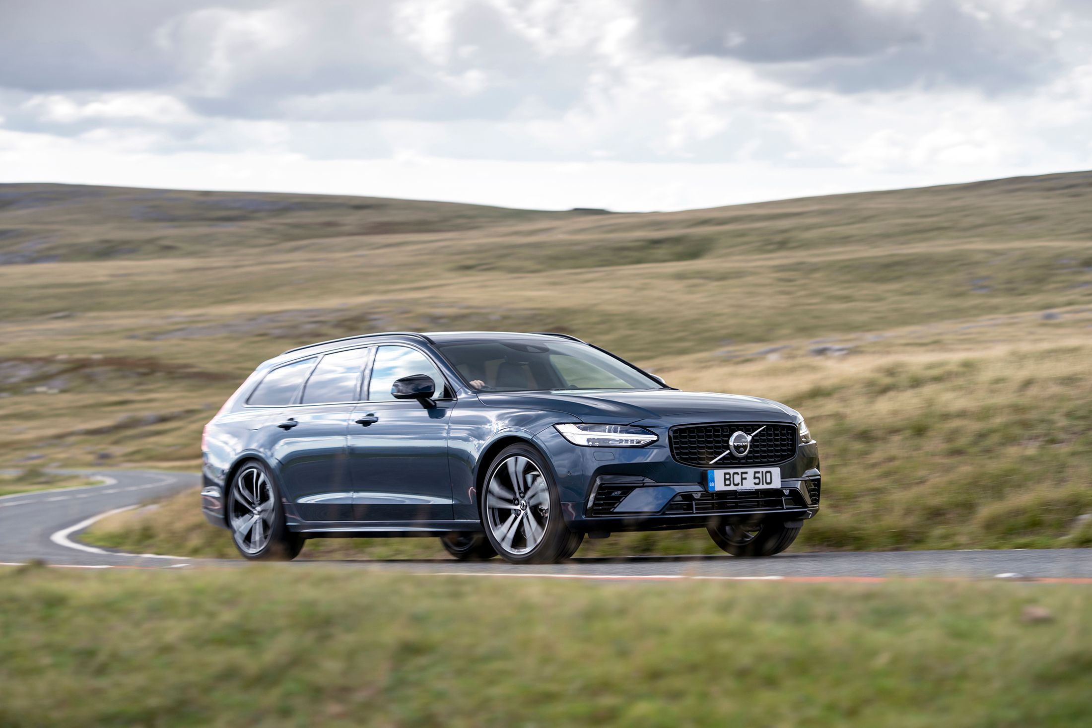Blue Volvo V90 driving