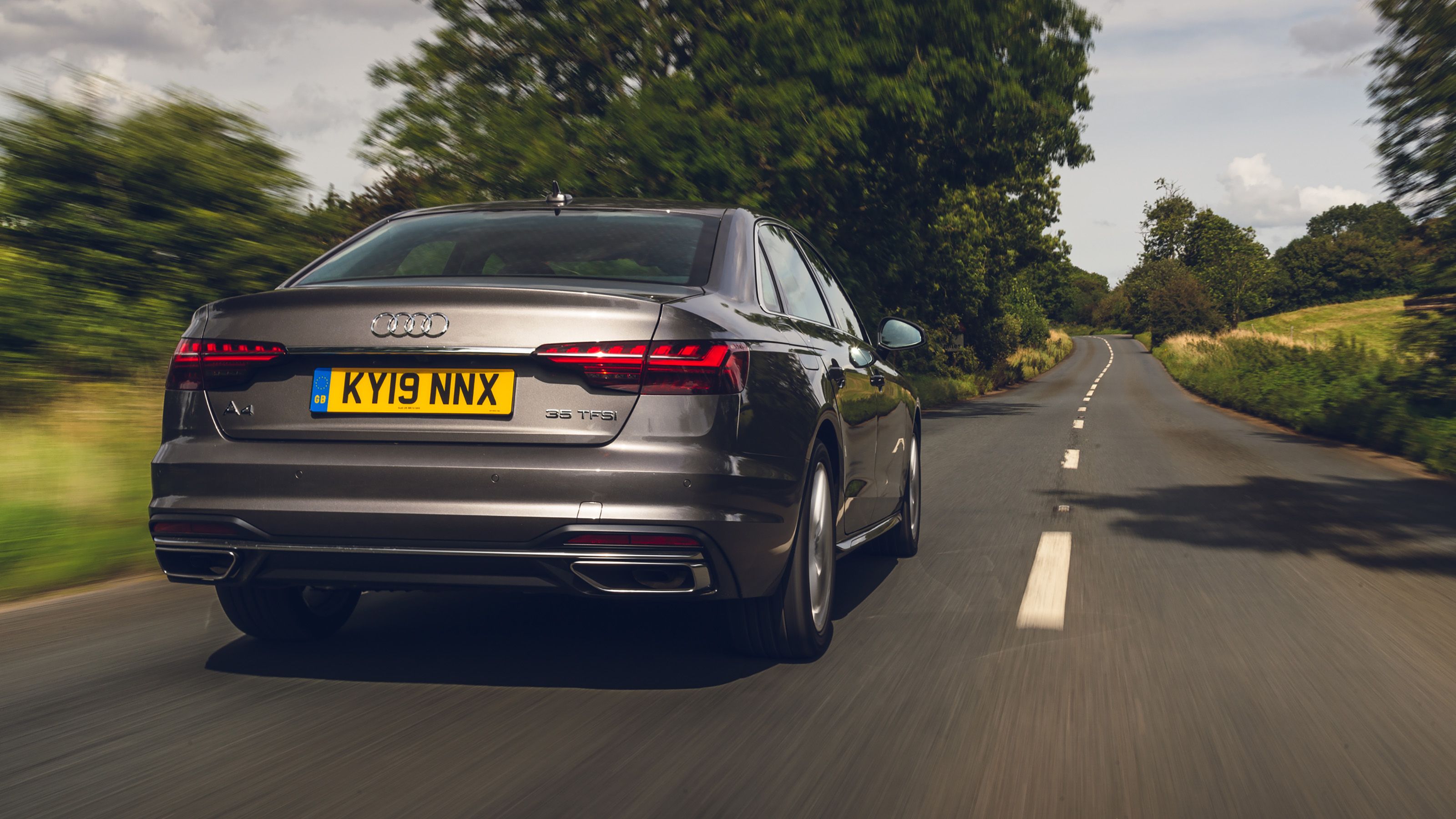 Brown Audi A4 rear driving