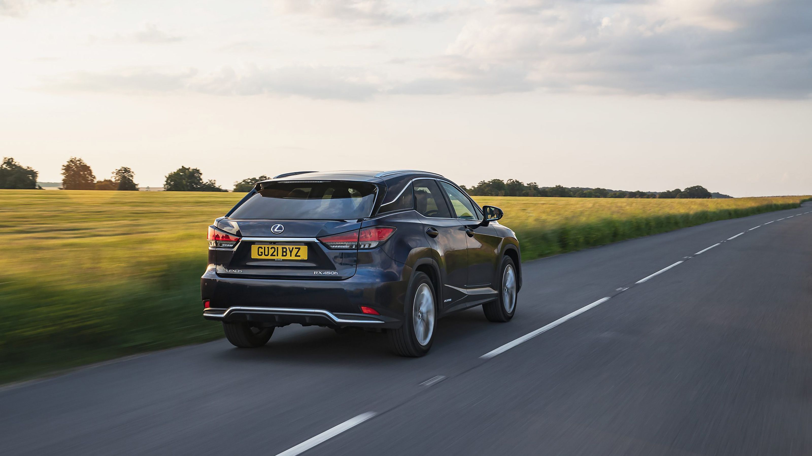 Blue Lexus RX rear driving