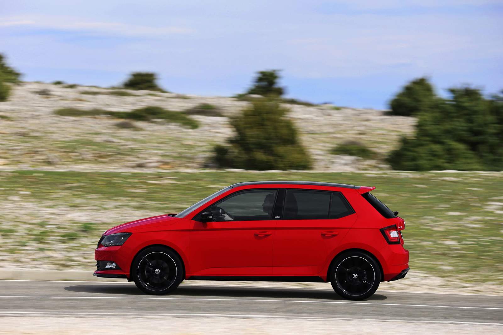red car on road