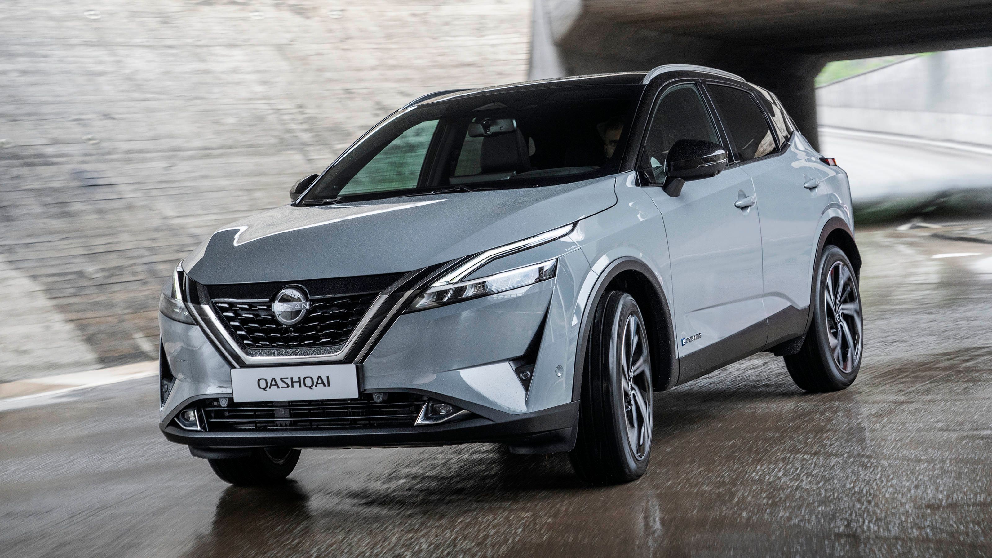 Grey Nissan Qashqai driving out of tunnel