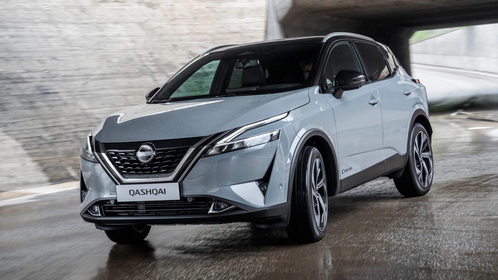 Grey Nissan Qashqai driving out of tunnel