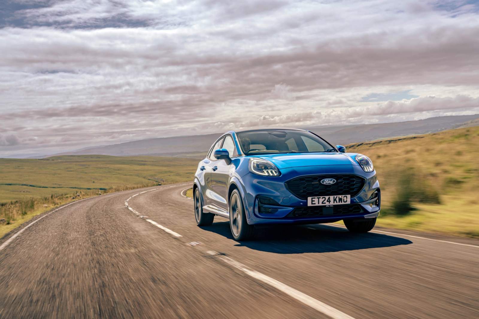 blue car on road