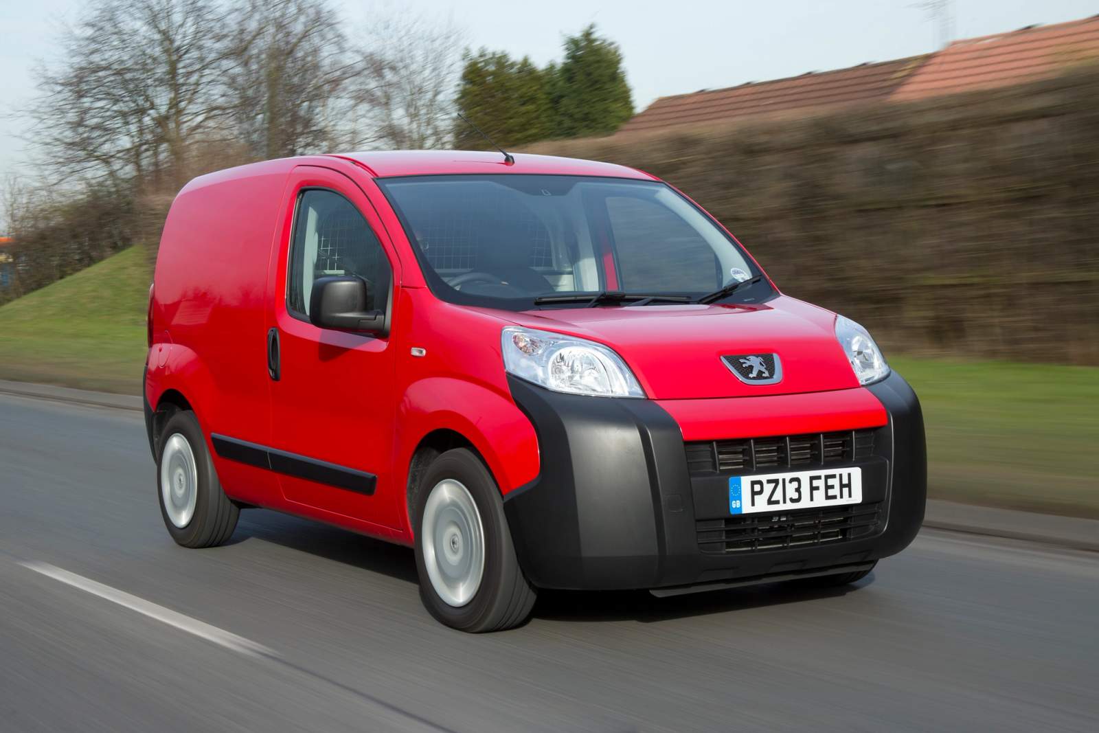 red van on road 