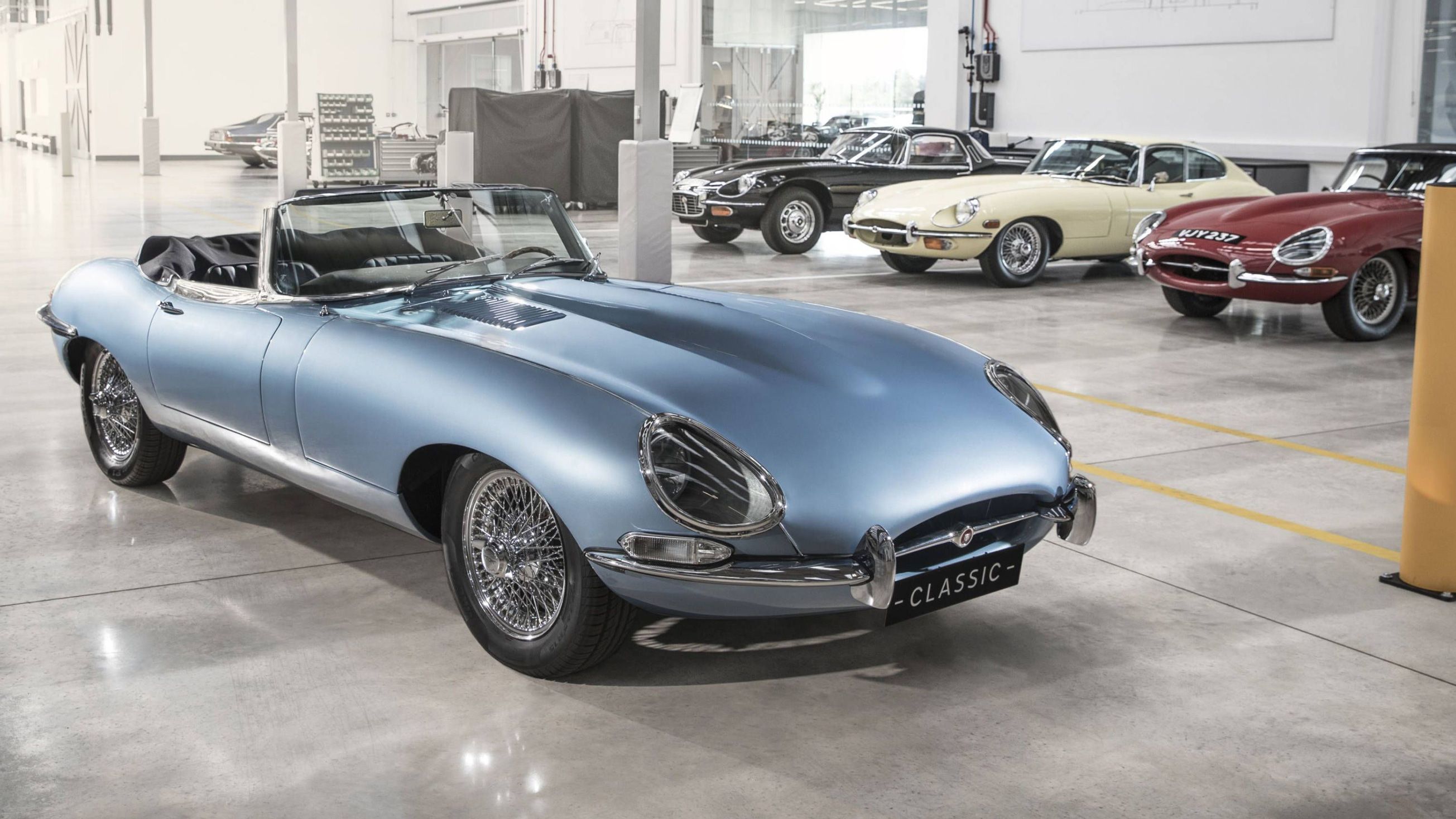 Blue Jaguar E-Type alongside other E-Types