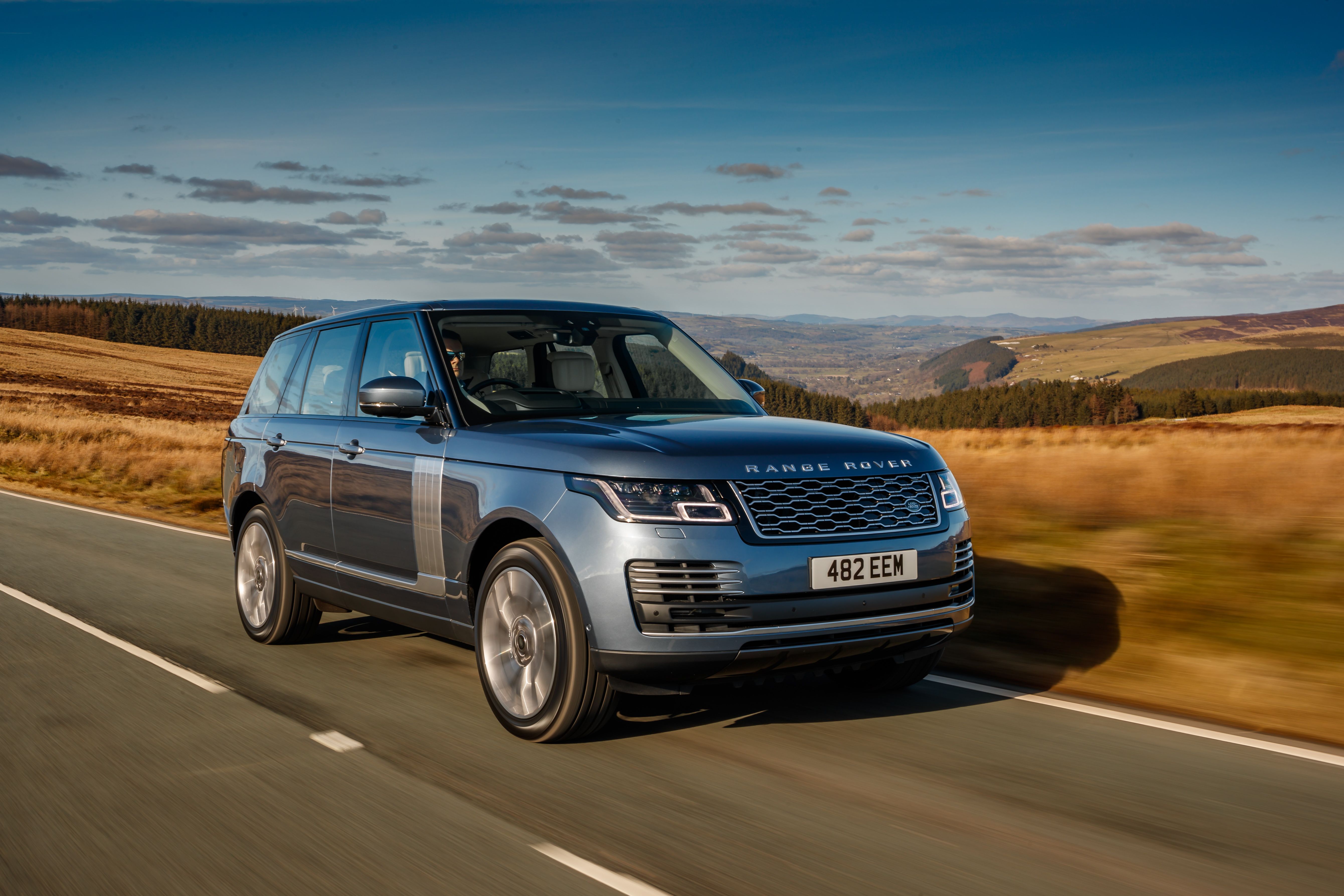 Blue Range Rover driving