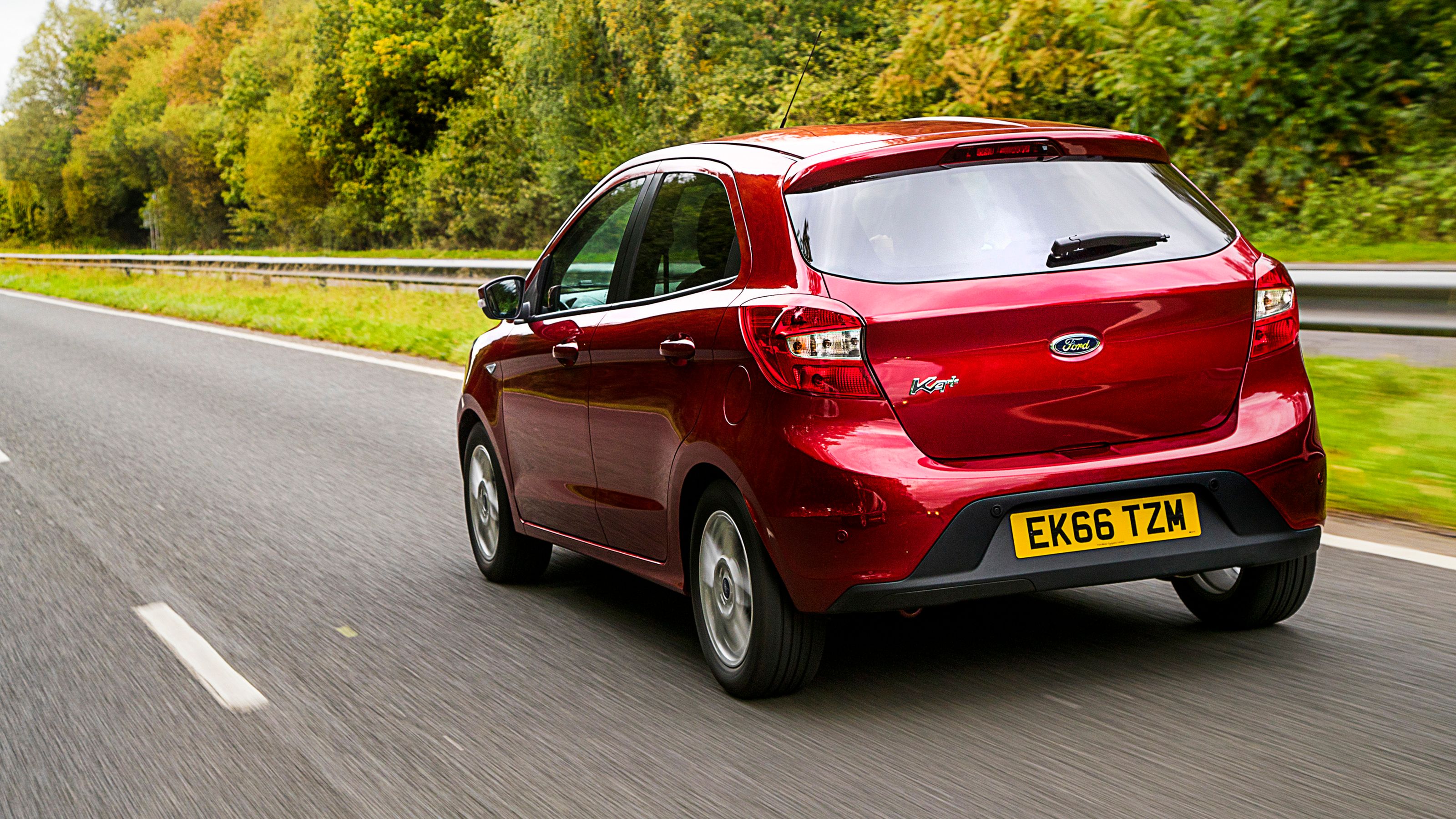 Red Ford Ka+ rear driving